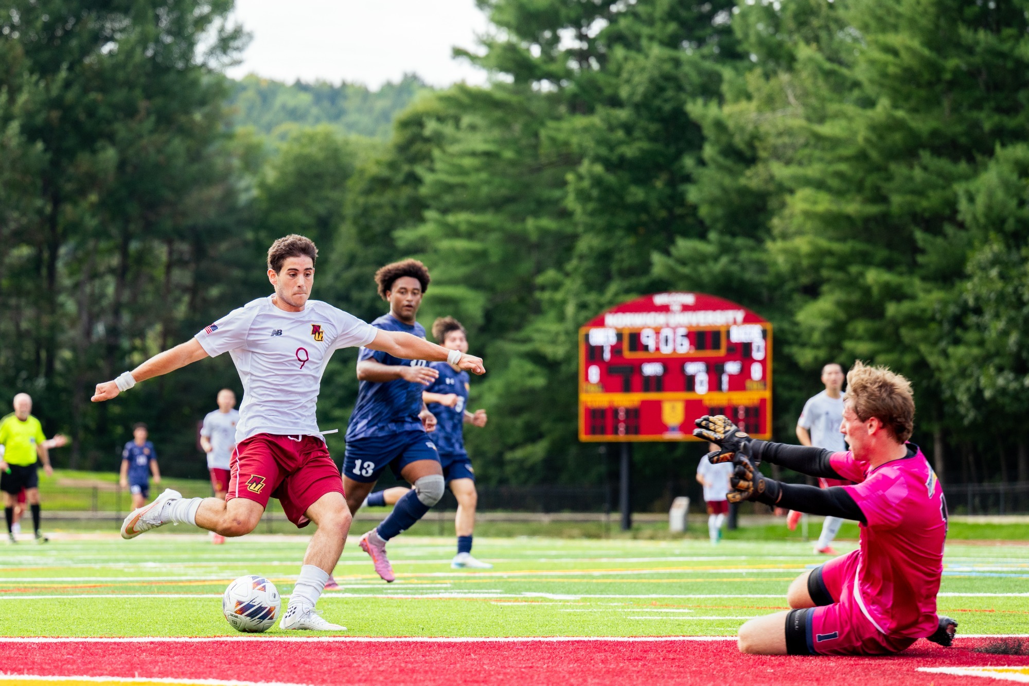 Hennessy beating the goalkeeper. 