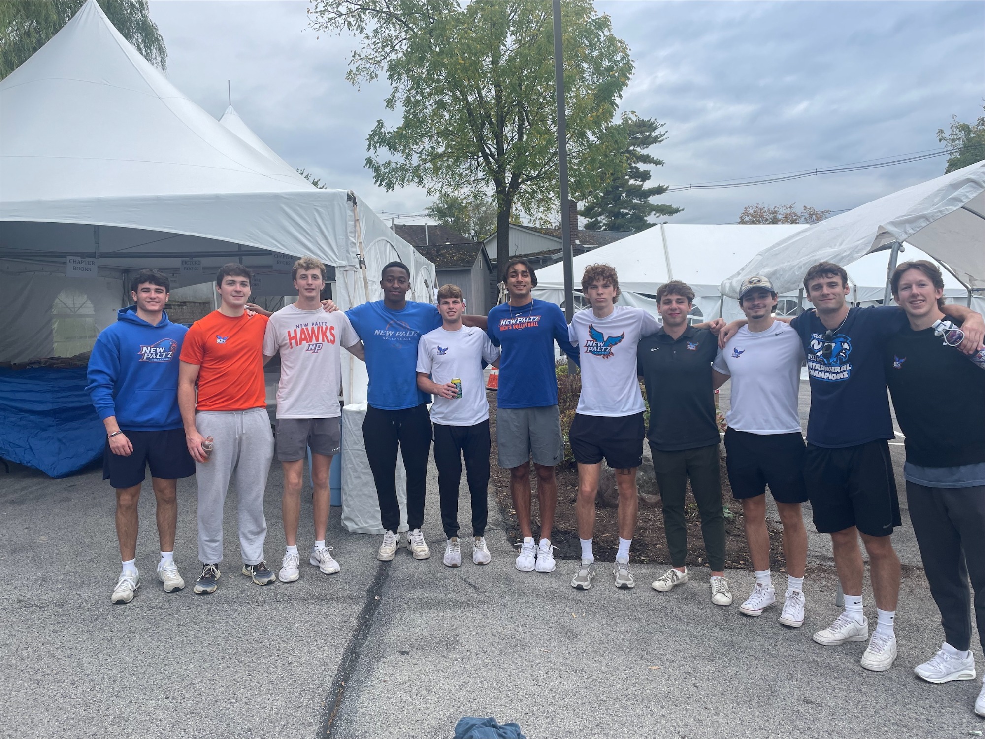 Men's Volleyball team poses for a photo 