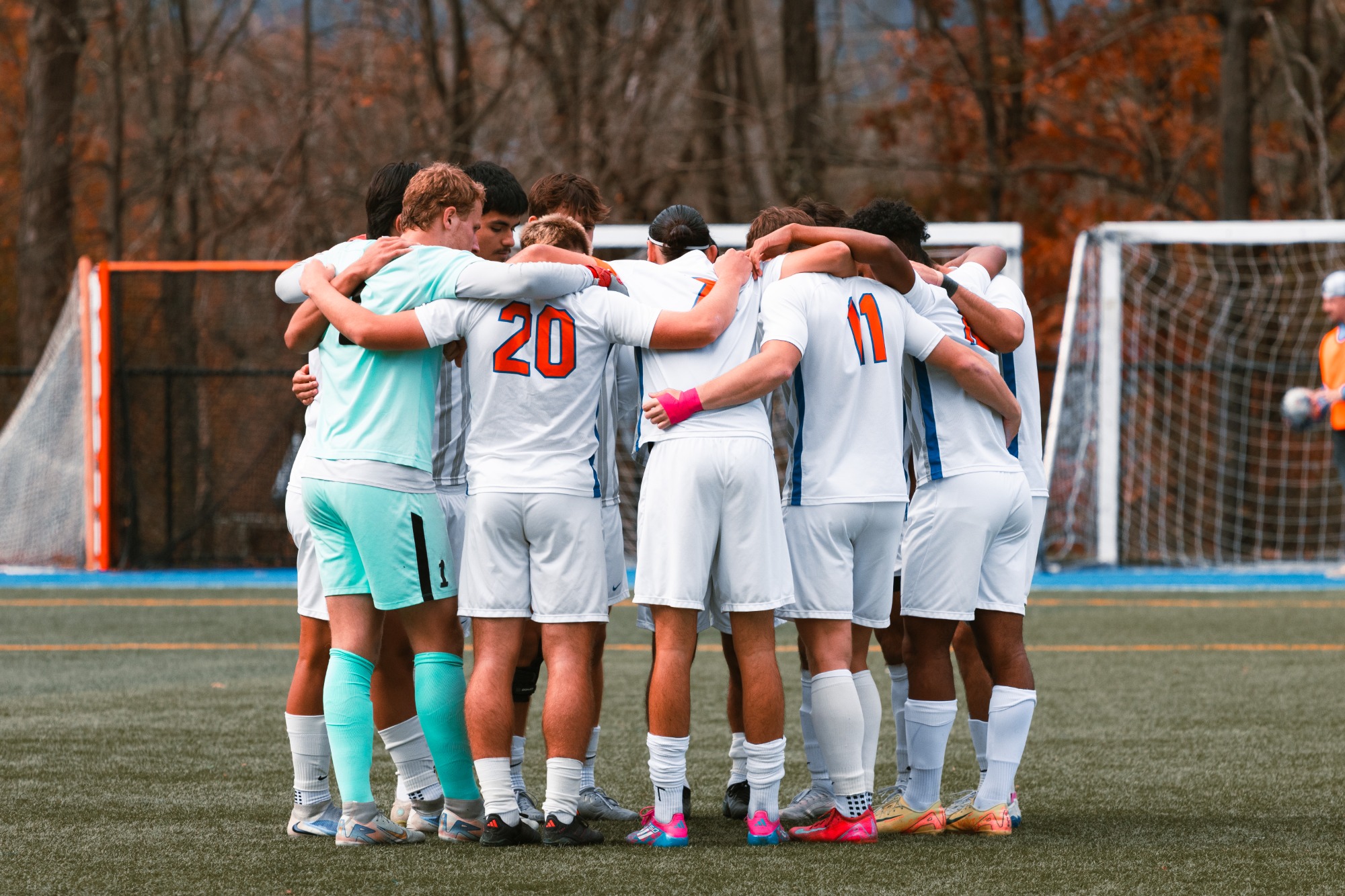 Hawks huddle pregame before kickoff against Canton