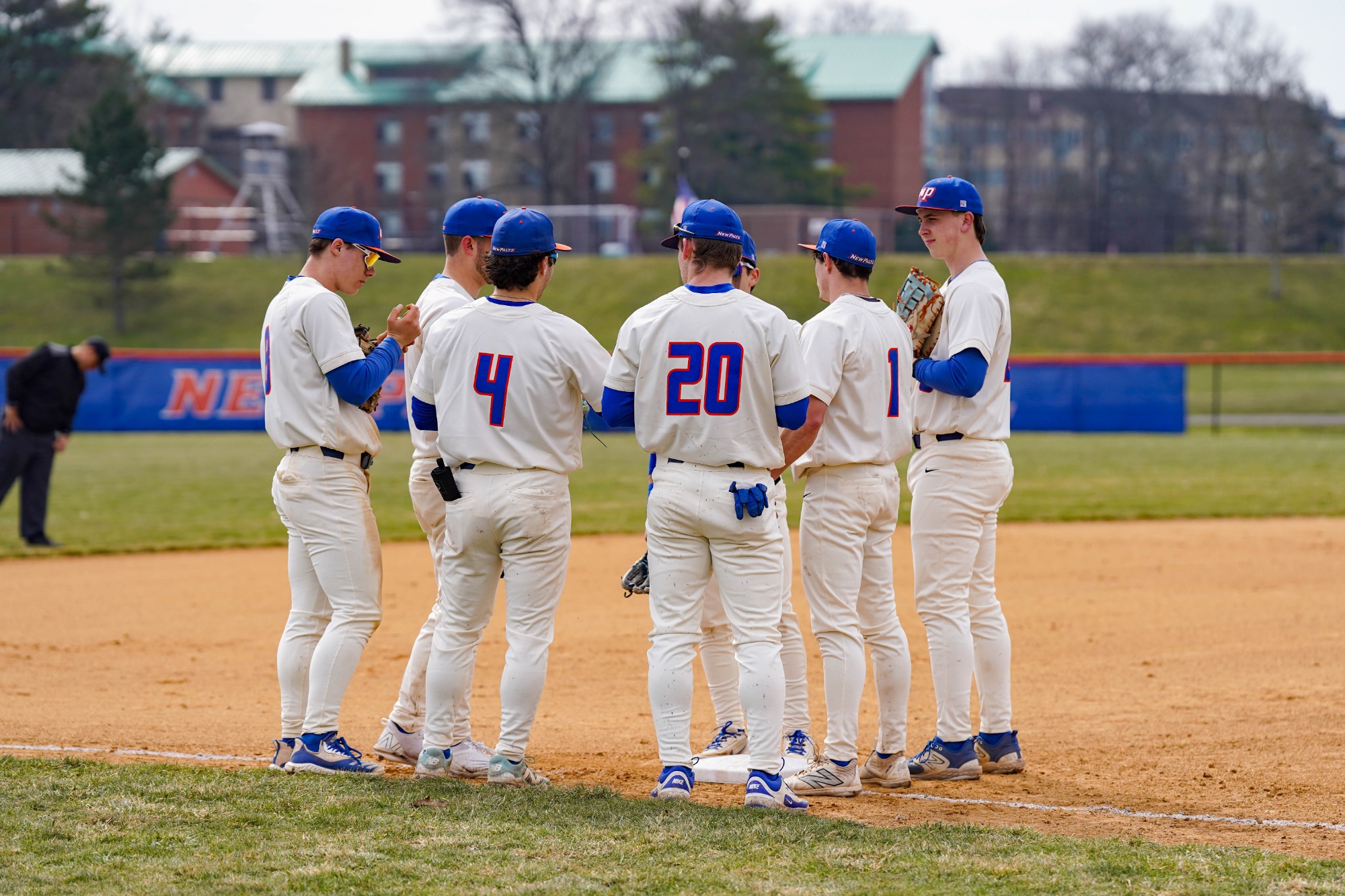 Hawks starters huddle in between innings