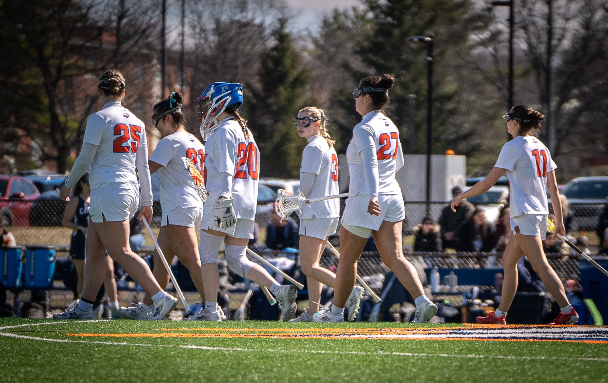 Hawks defense walks back after their offense scores a goal