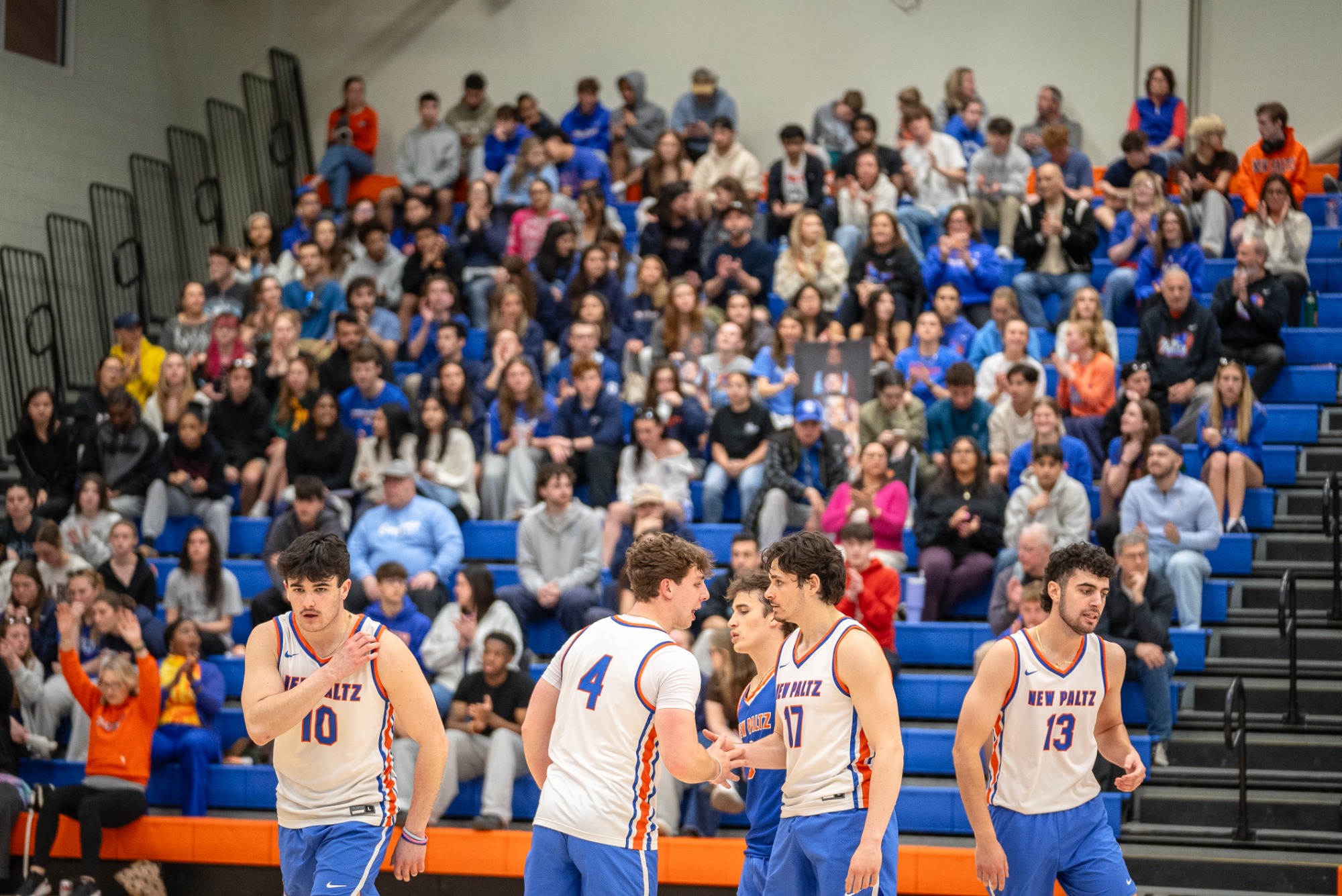 Hawks huddle while the Hawk Center crowd watches on