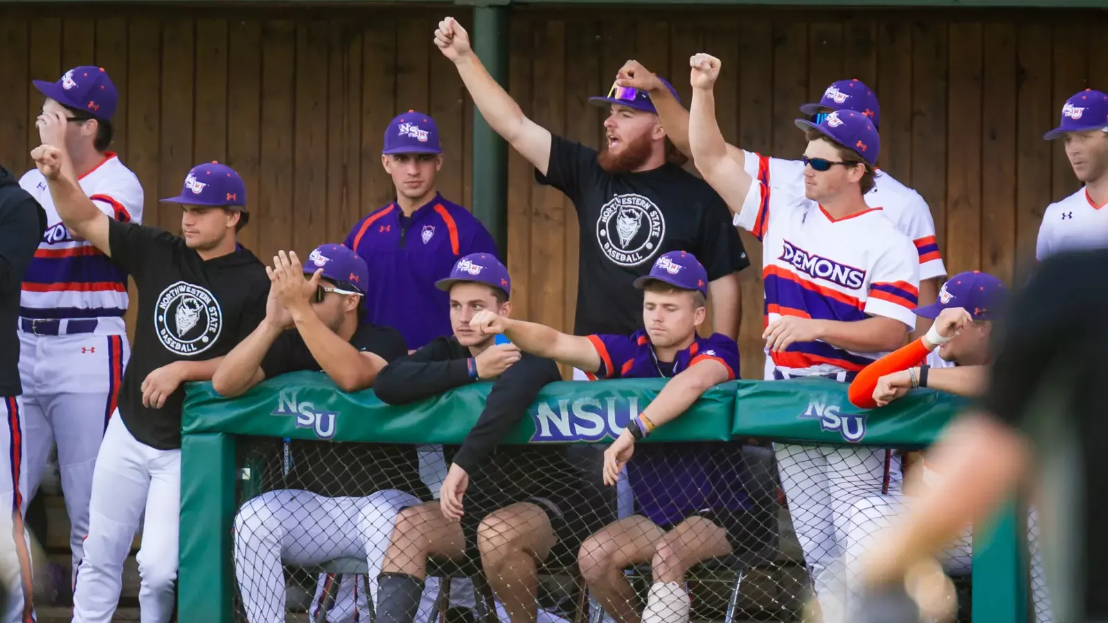 Team celebrates in the dugout