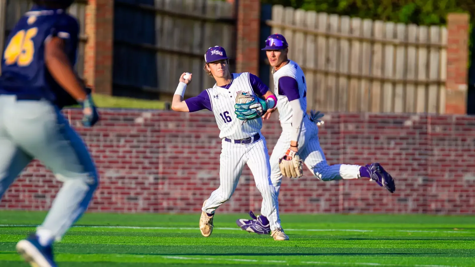 NSU 16 Zach White SU 45 Gleen Green III th\rowing the ball to second base