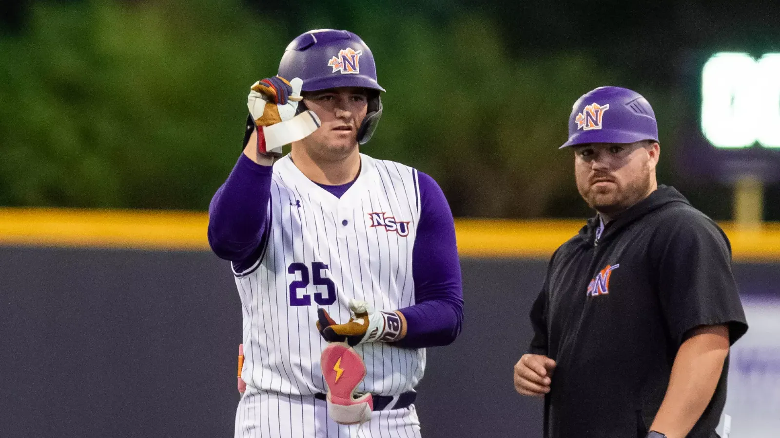 NSU 25 Ethan Menard and graduate Assistant Brennan Lambert at first base