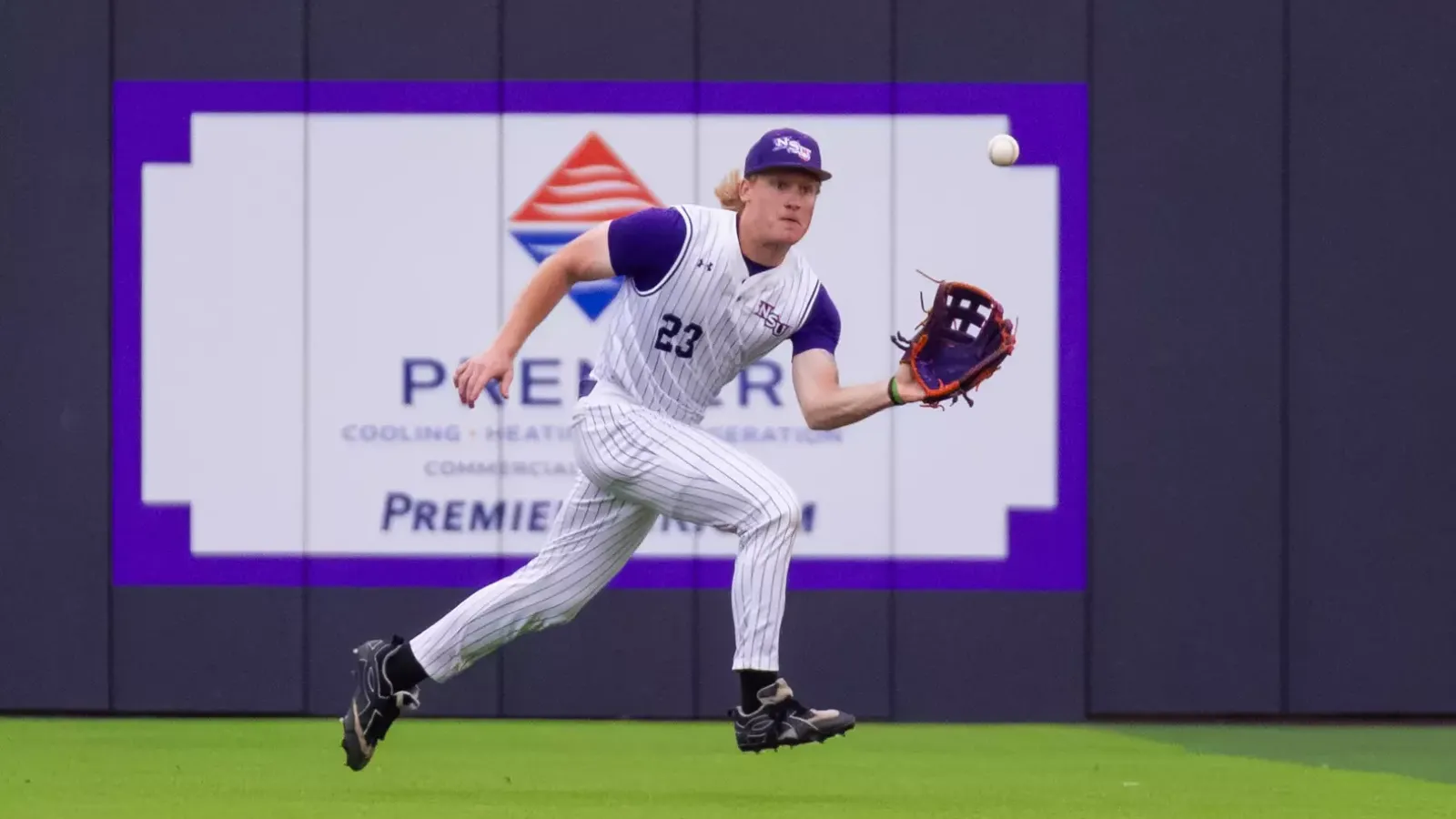 NSU 23 Joe Siervo catching the ball in the outfield