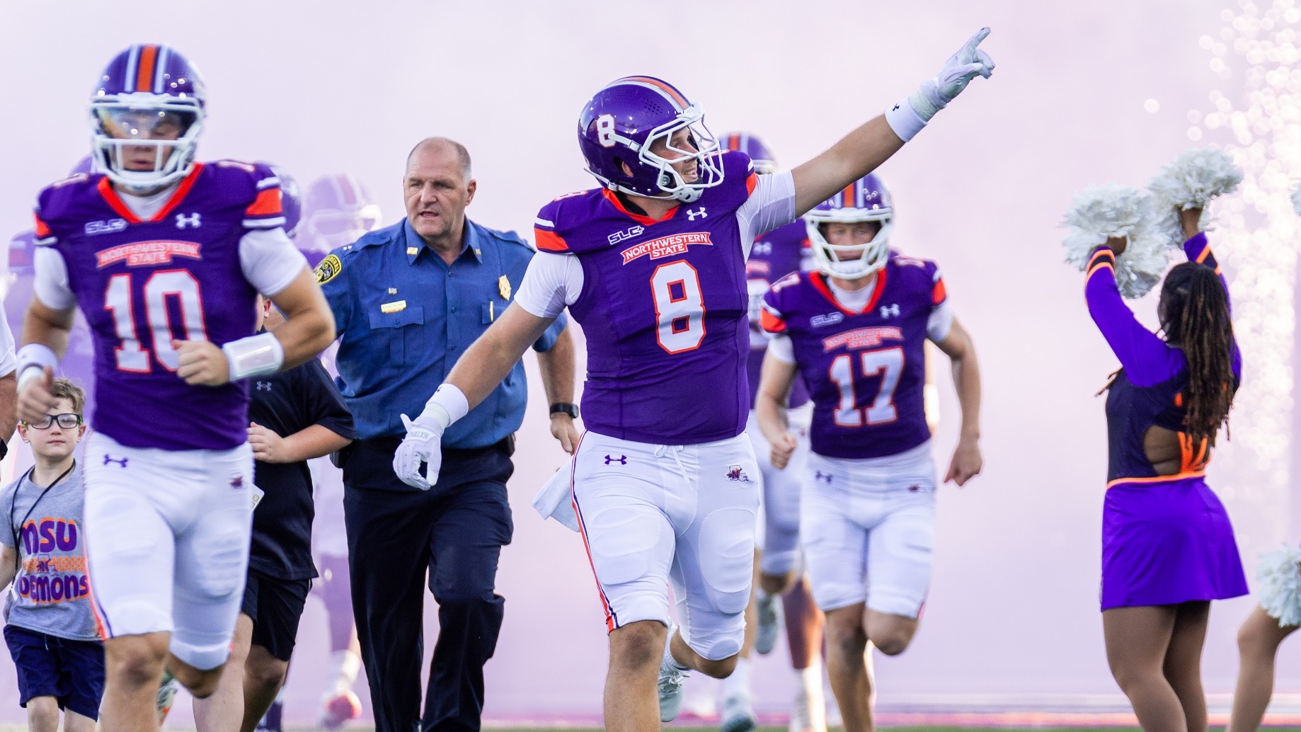 Luke Carter leads the NSU football team out of the tunnel during pregame ceremony.