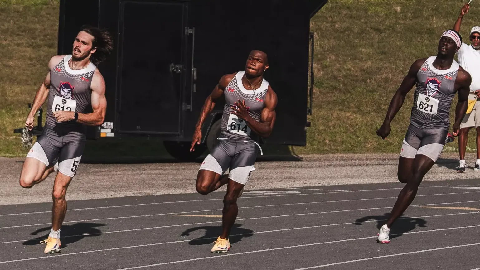 Will Achee, Charlie Bartholomew and Desmond Duncan in the 400 meter finals