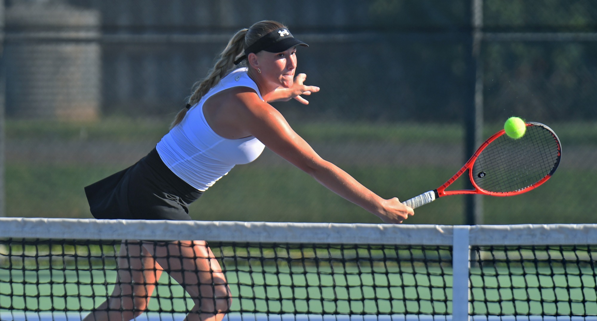 Zala Vnuk returns a shot during Saturday's action at the Lady Demon Invitational.