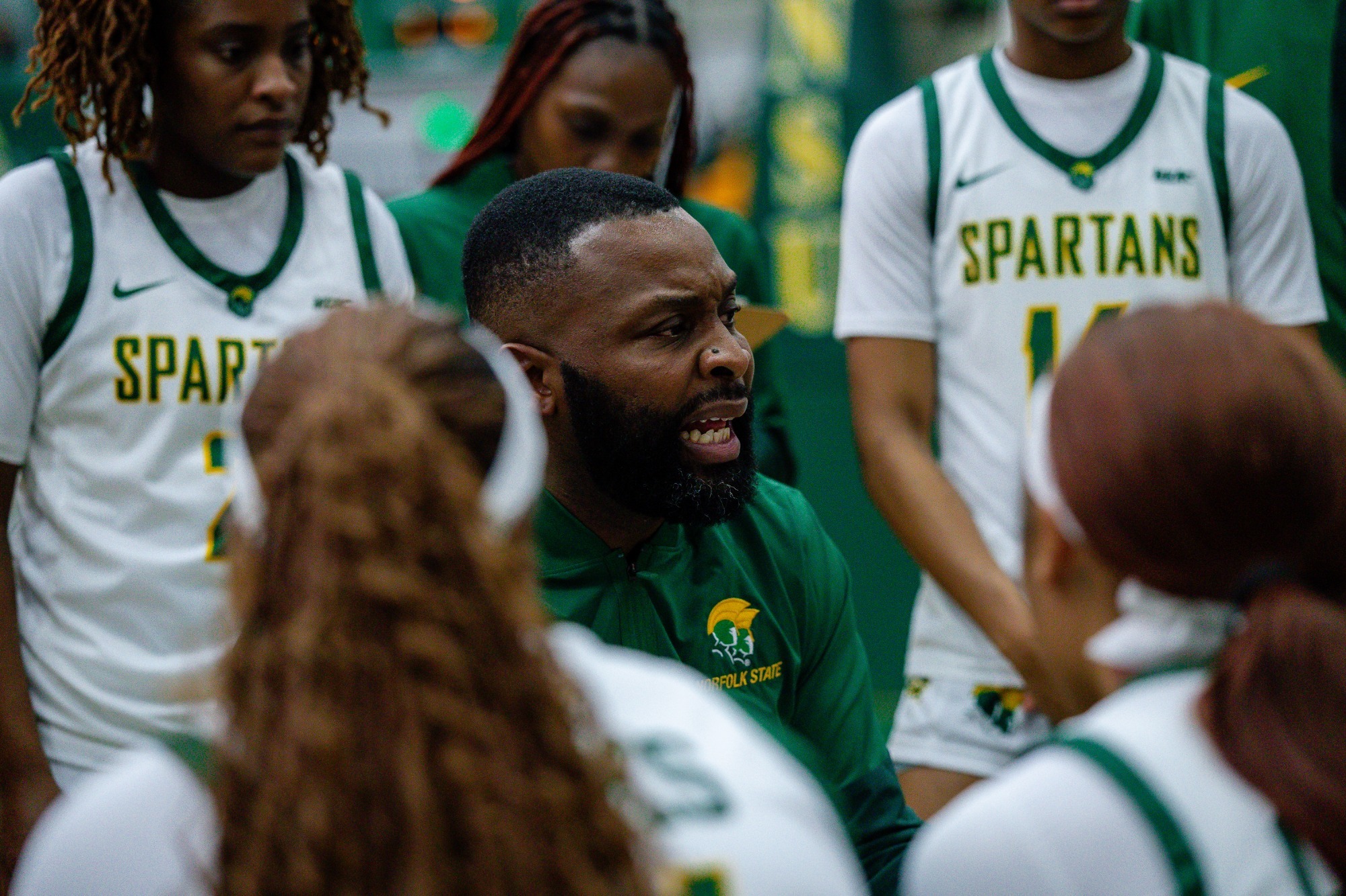 Coach Woods rallies the team during a timeout