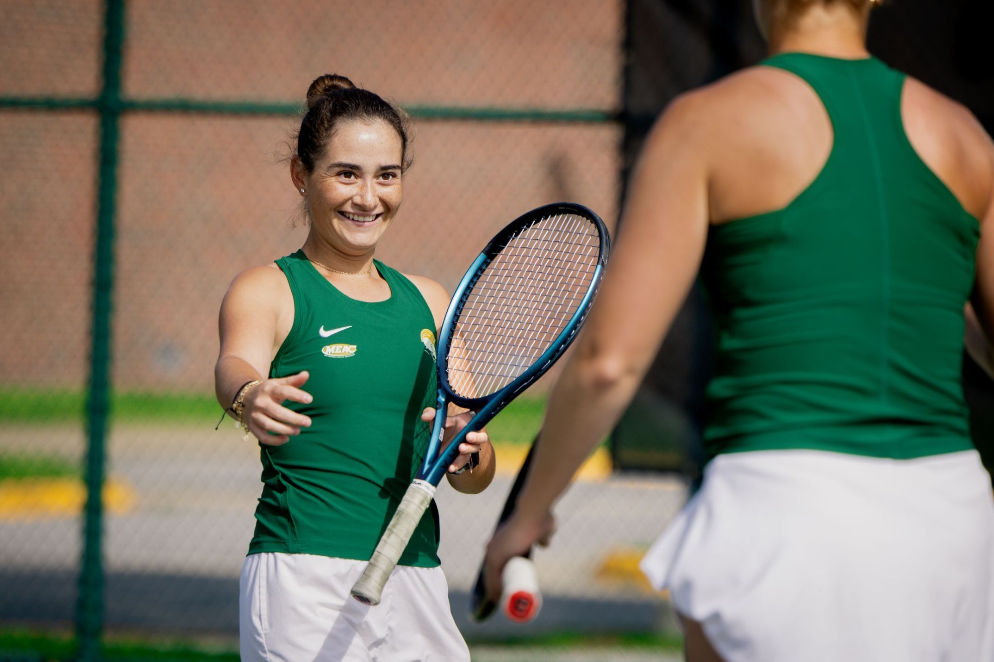 Regina Urbiola celebrates doubles win