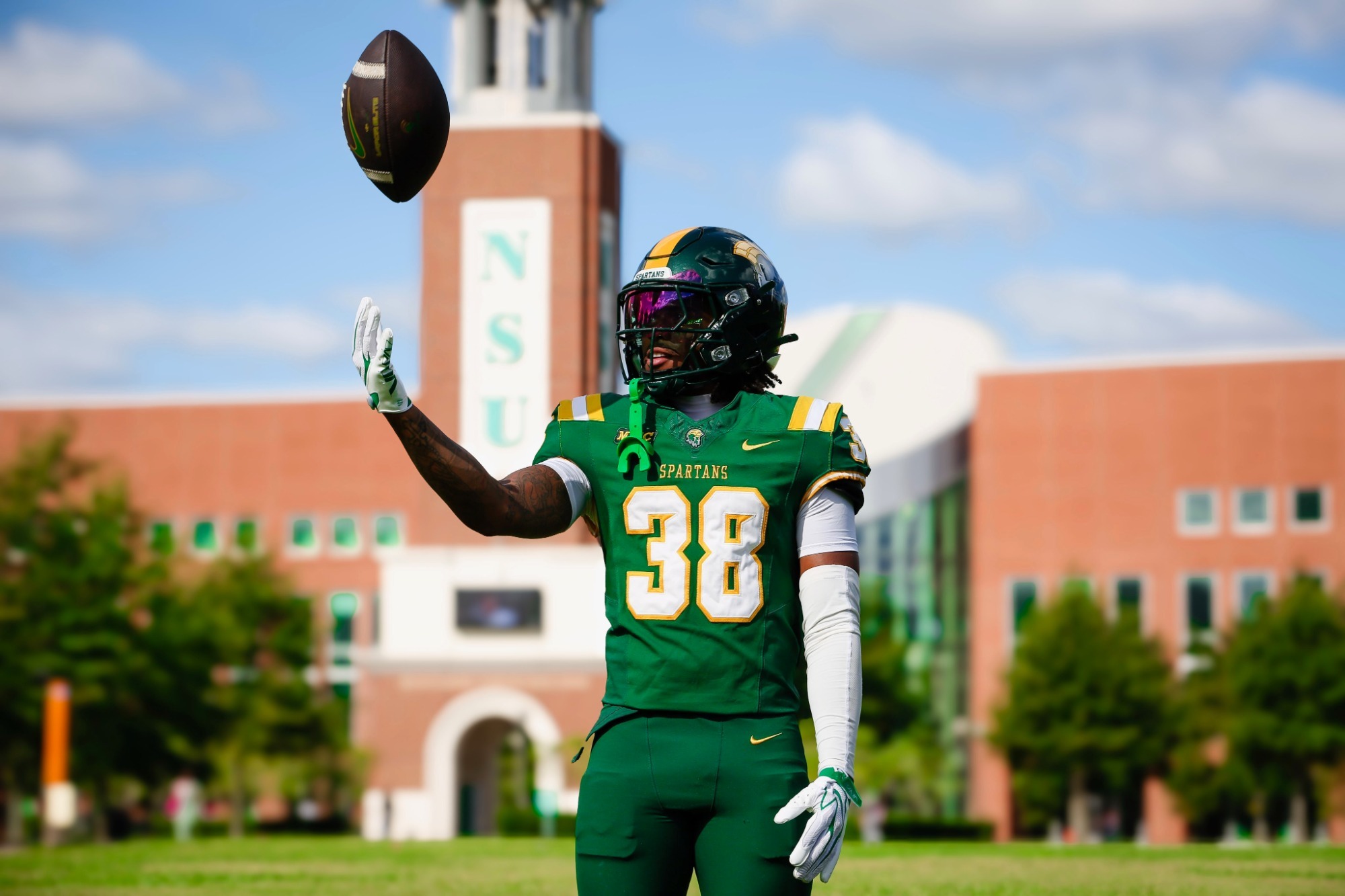 Christian Henry infront of the Henry Clock Tower, center of Norfolk State's campus