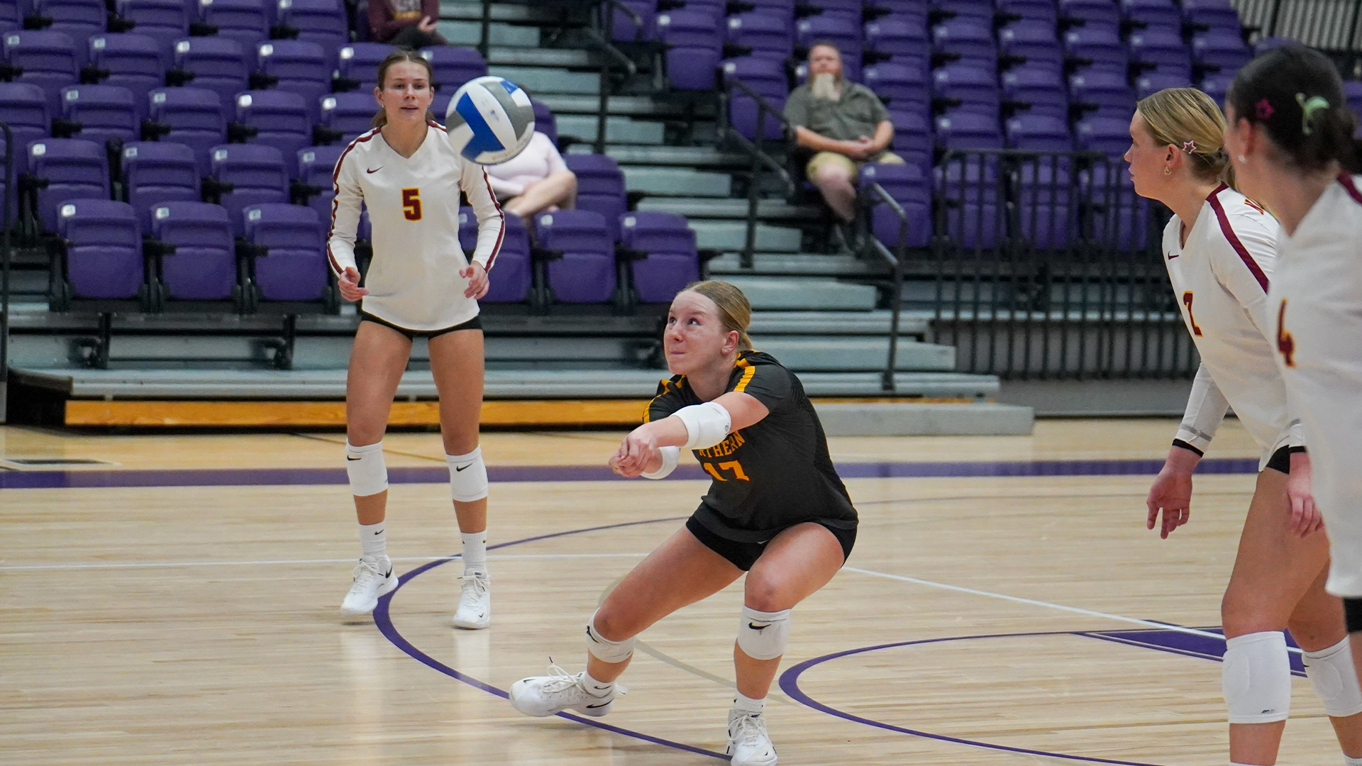 10.24 Volleyball Recap - Ashley Yost drops down to the floor in a sliding reach for a dig