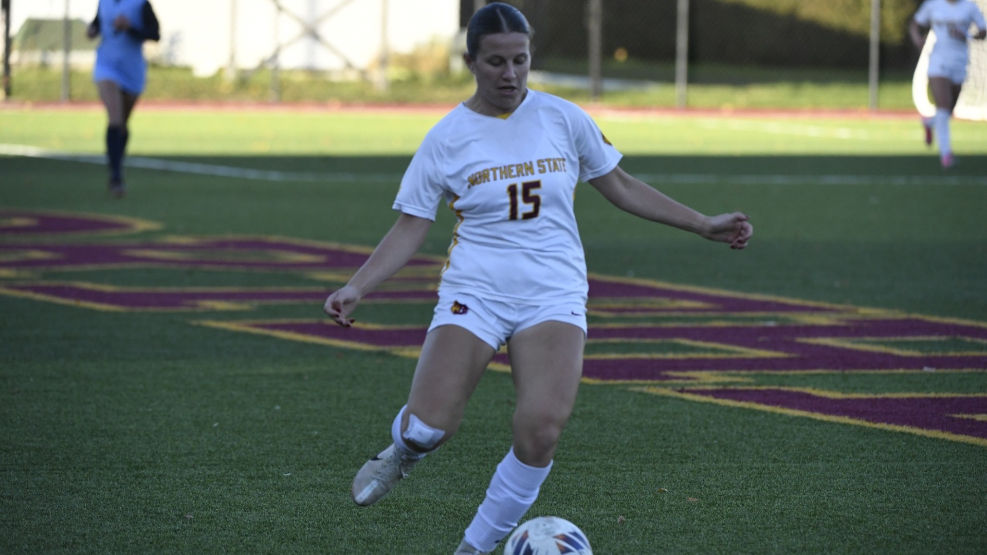 Kylie Albert kicking the ball to a teammate when the Wolves beat Augustana 2-1.