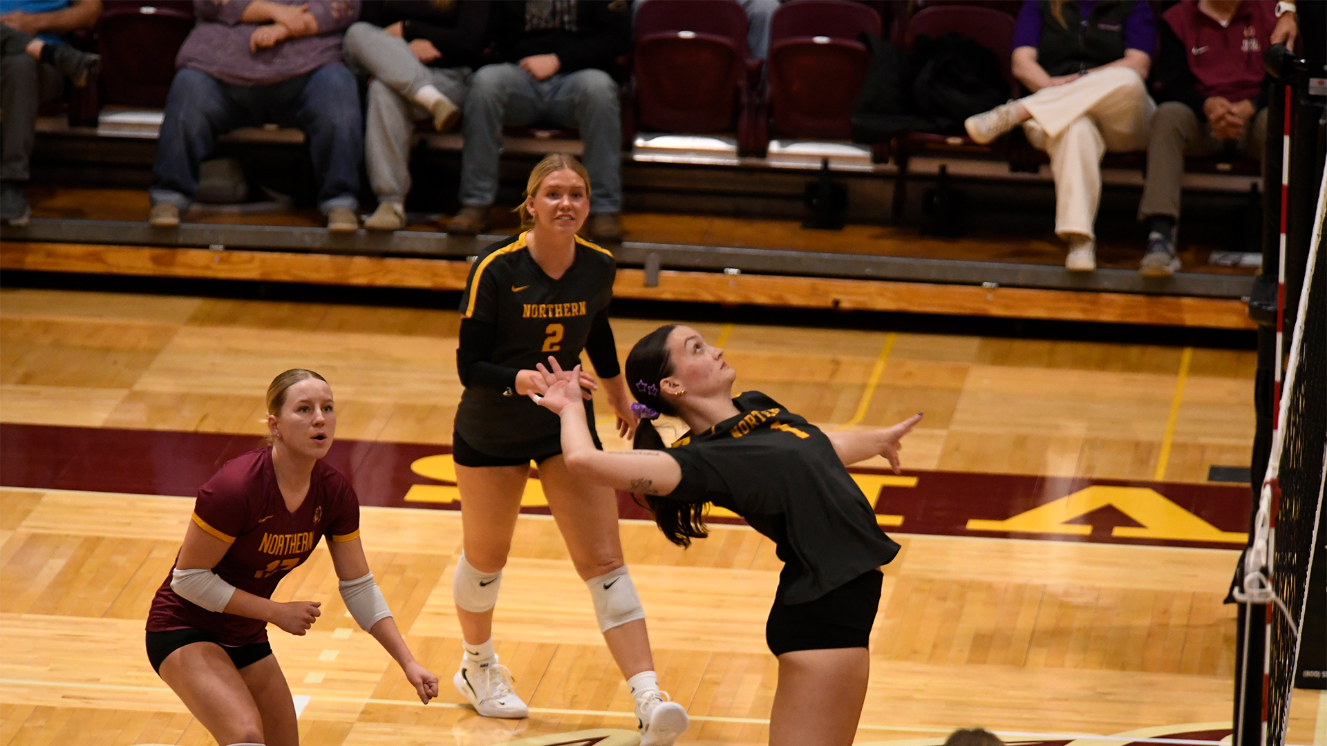 10.3 VB Recap - Victoria Persha mid-air for an attack as her team looks on
