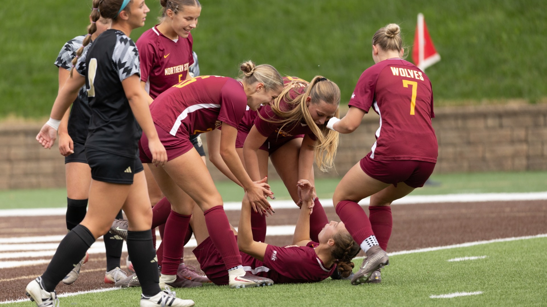 NSU's women's soccer team celebrating after Lauren Youngquist scored her second goal in their 2-0 victory over SMSU on Friday.