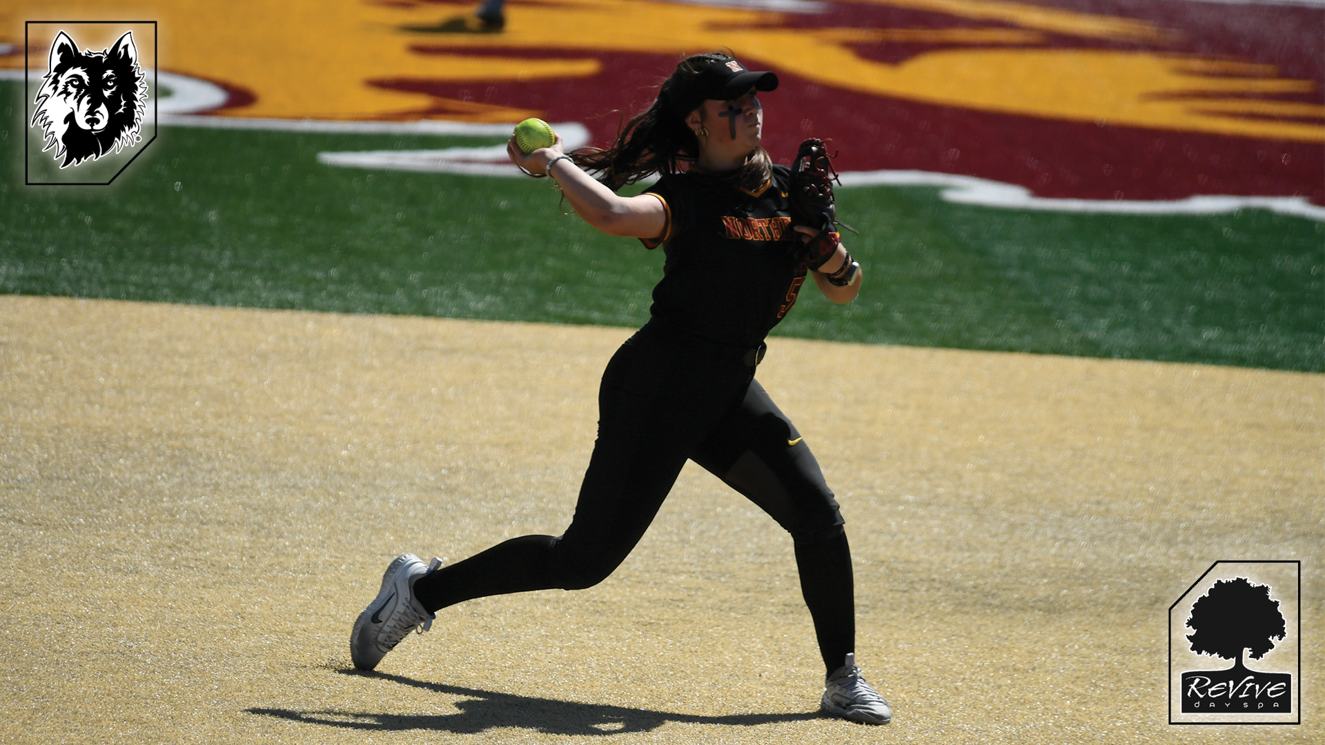 Freshman Alicia Jeanson throwing the ball to first base to record an out.