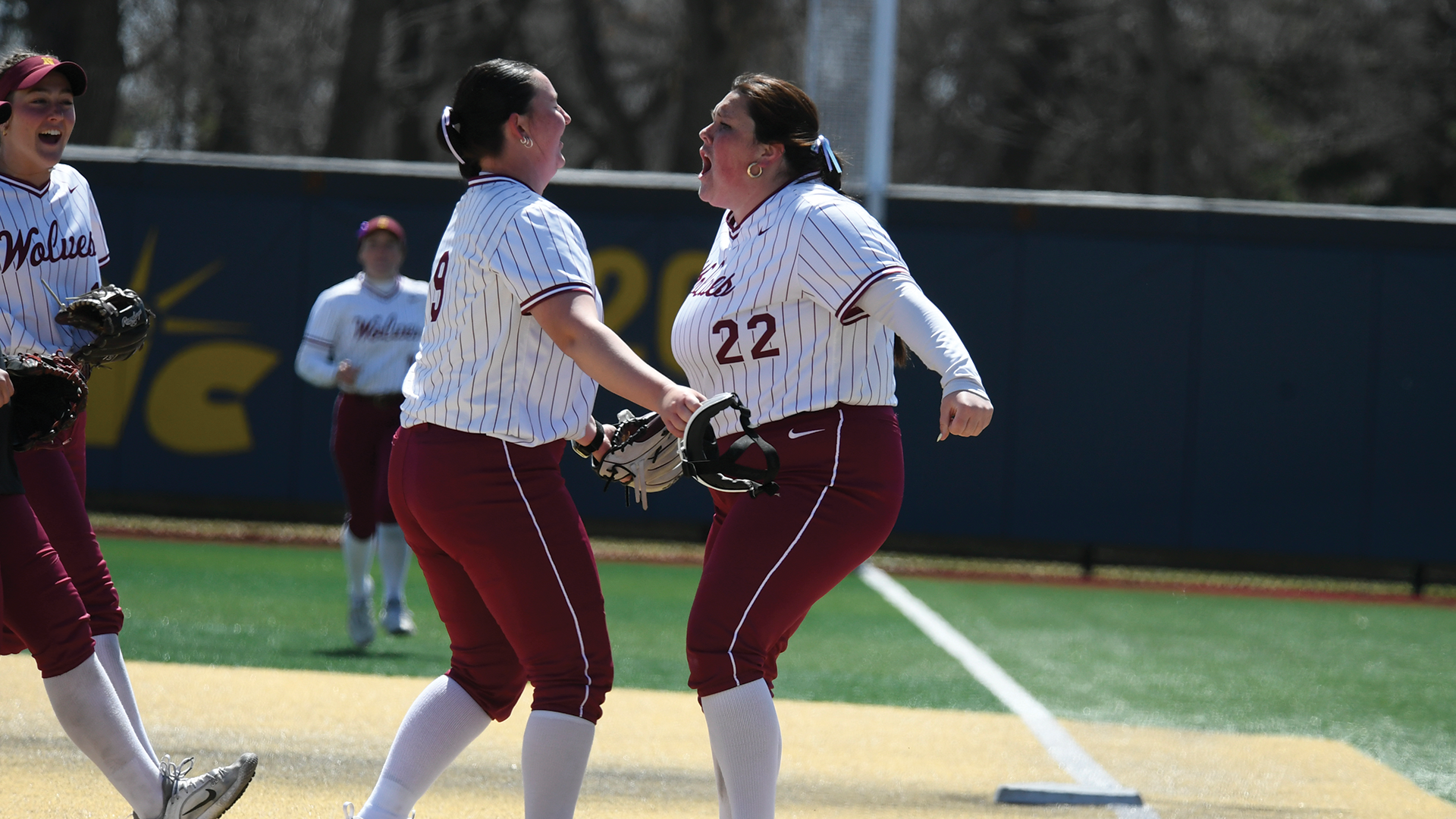 Tevan Bryant and the Wolves swarming Mckenzie Wanner after throwing a complete game in NSU's 3-2 victory over MiSU