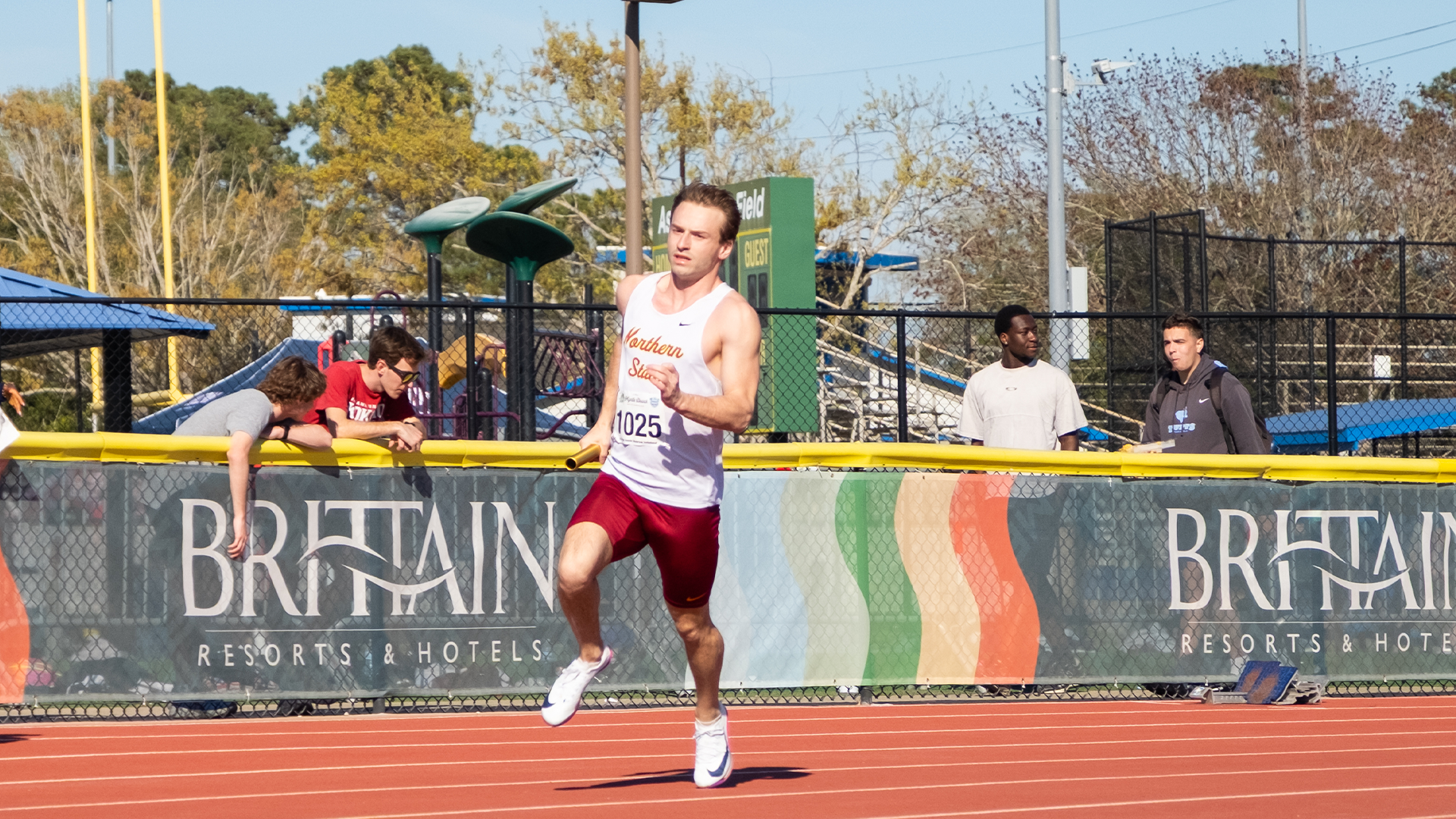 Chris Weber rounds the turn as the second leg in the 4x100 Shamrock Invite relay.