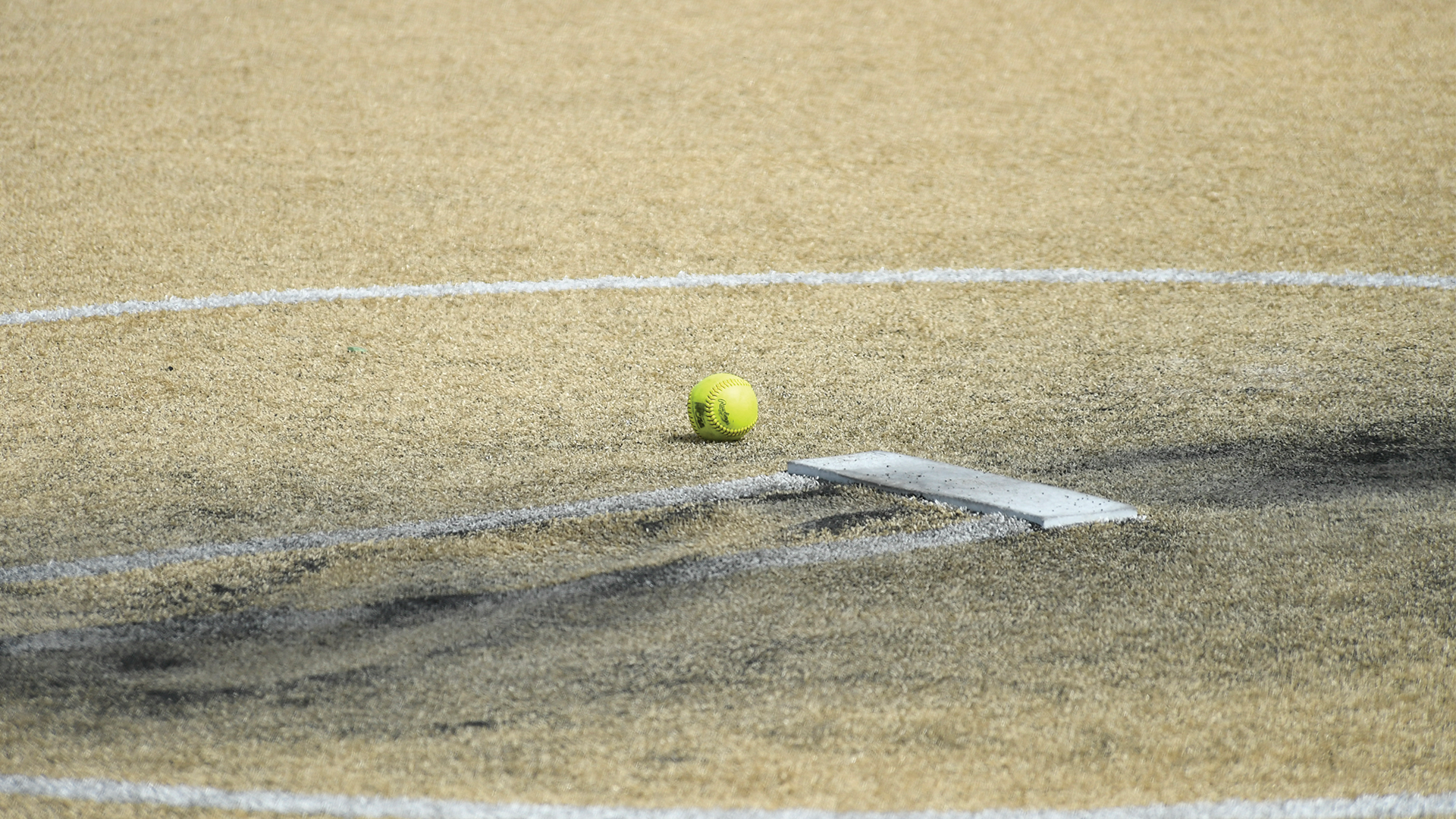 A softball sitting near the mound in between innings of the NSU vs UMM doubleheader.