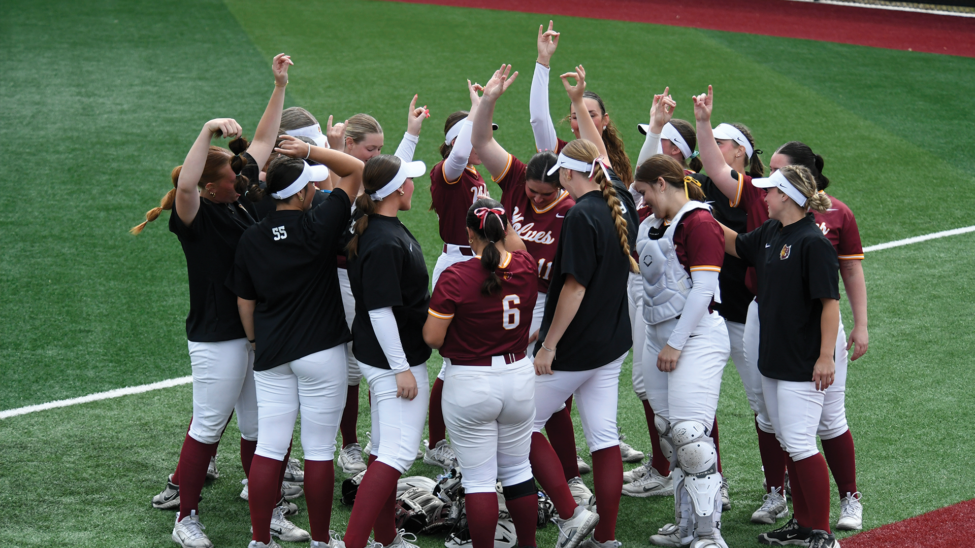 The NSU Wolves gather in a huddle before their doubleheader against Minnesota Morris.