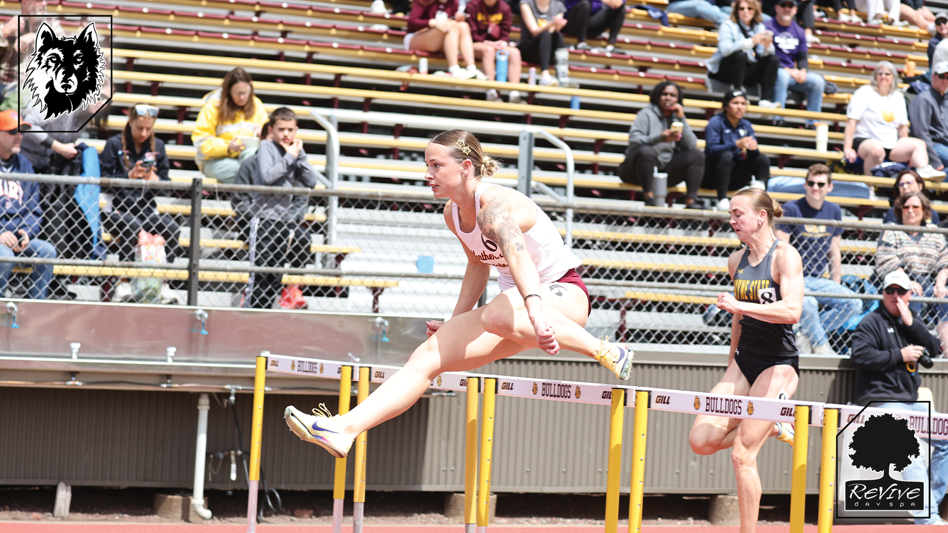 Renea Taylor flies over a hurdle in her record breaking 100m hurdle run at the NSIC Outdoor Championships