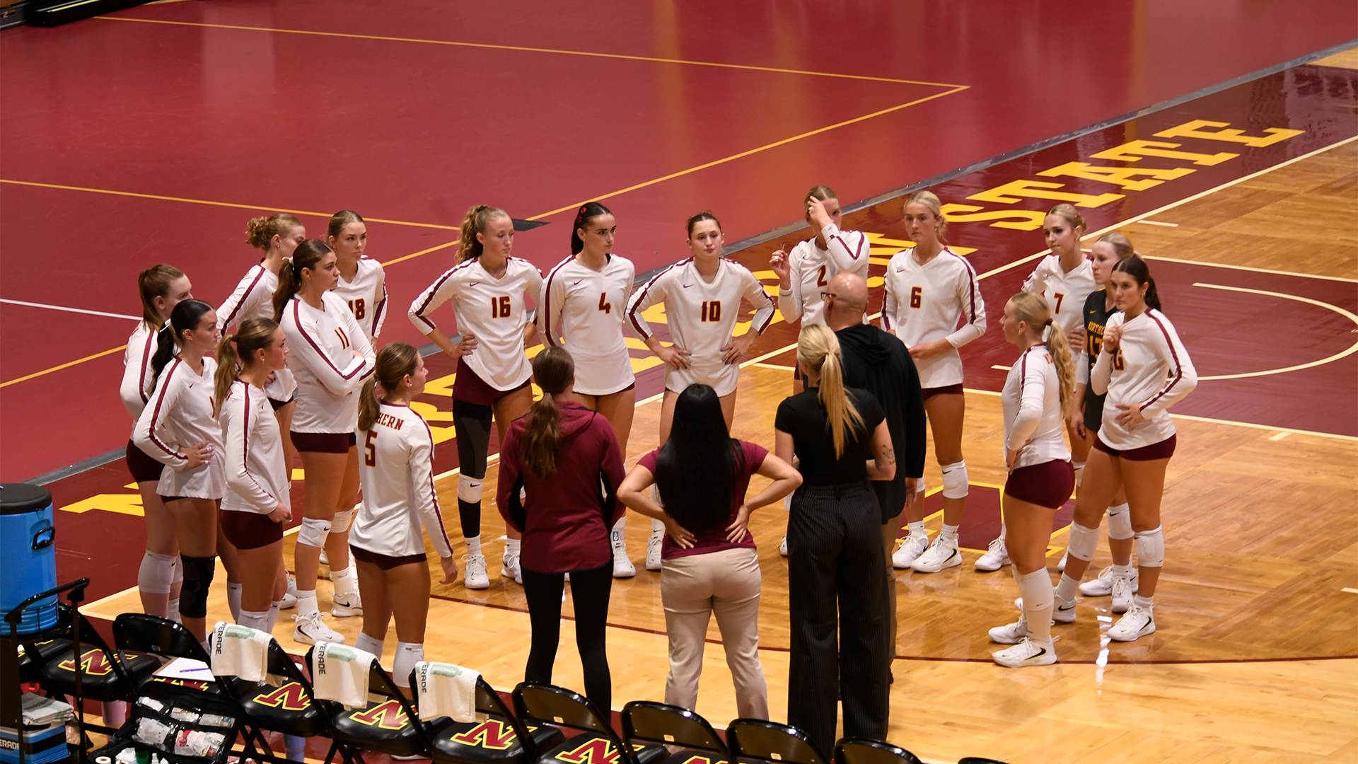 9.11 Volleyball Recap - Whole team groups up to listen to head coach Brent Aldridge before the match