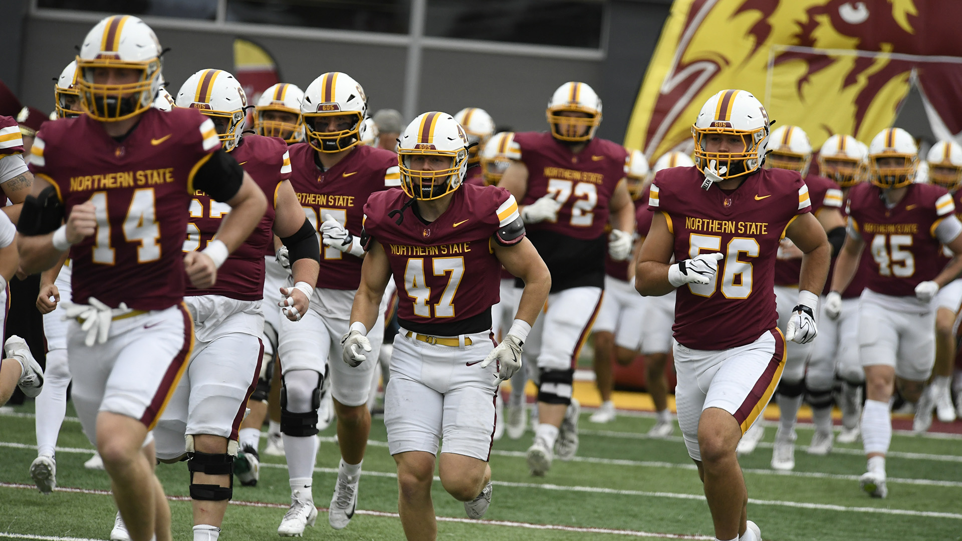 Team running out of the tunnel