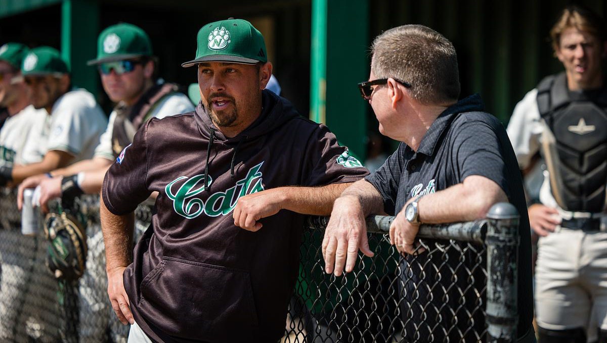 President Lance Tatum throws the first pitch of the game against UCM. Mar 31, 2026 (Photo by Lilly Cook | Northwest Missouri State University)