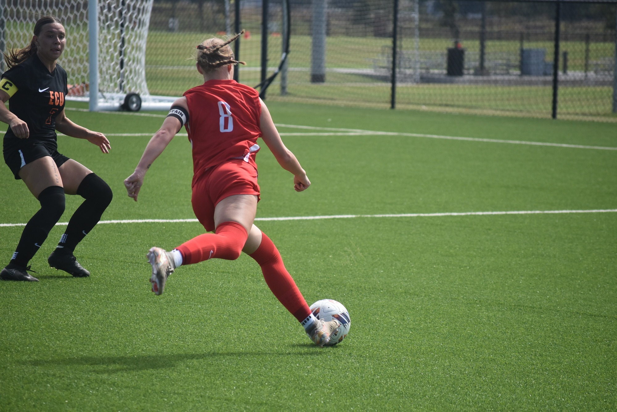 Jenna Mills kicks the ball