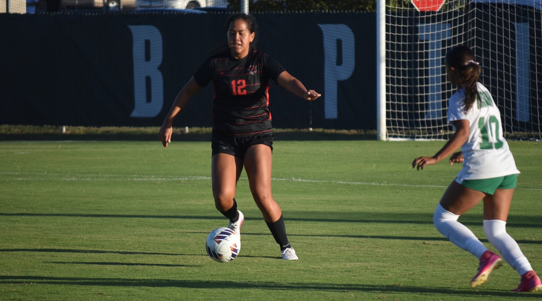 Kamalei Kealoha kicks the ball