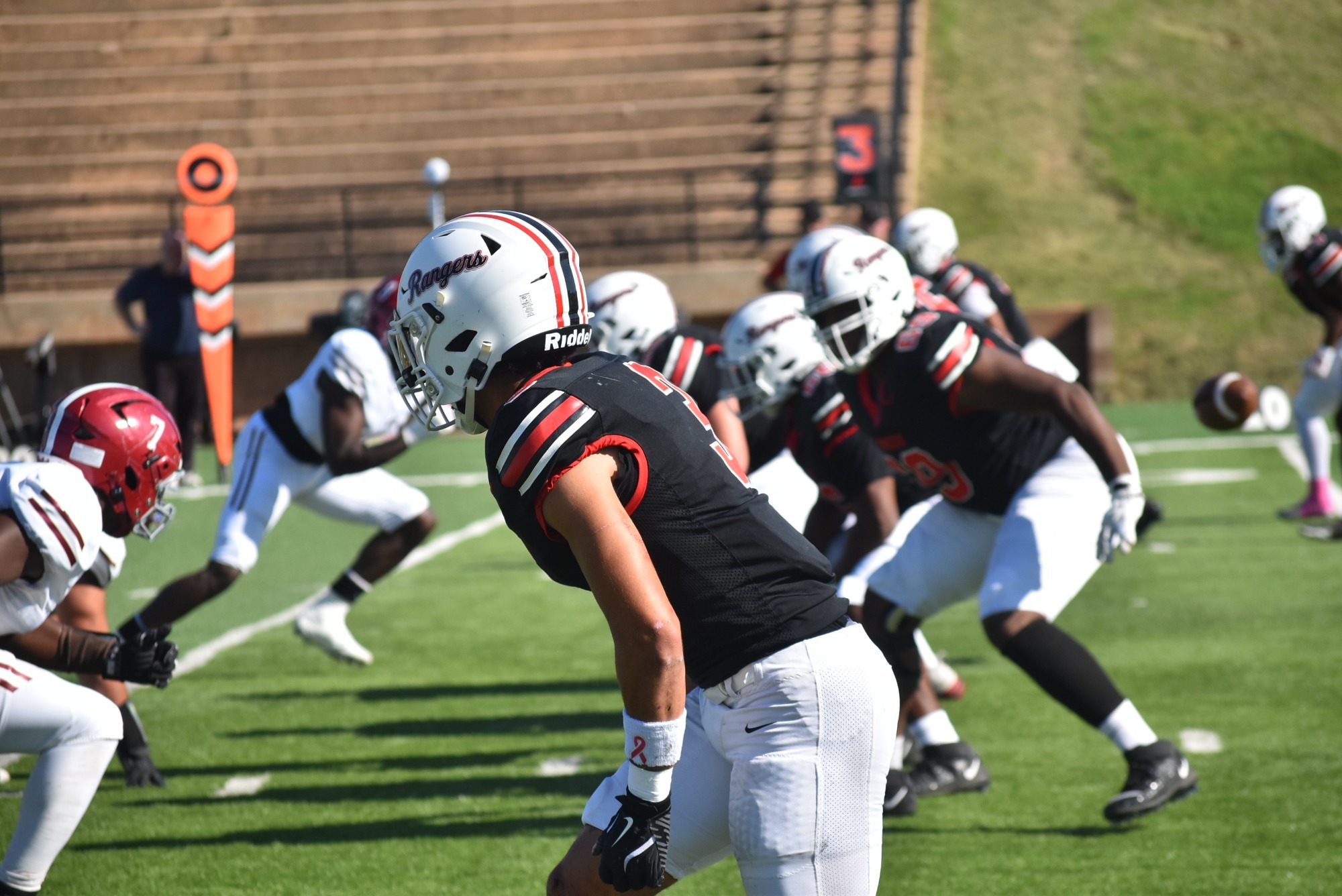 Football players lining up before a play
