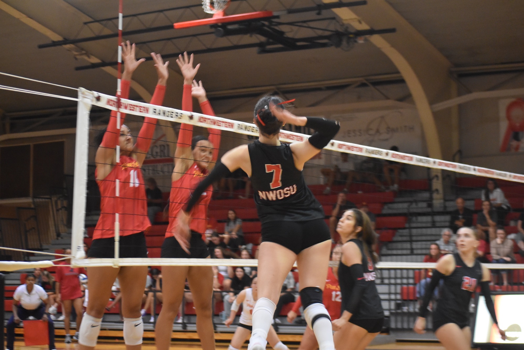 Volleyball player hitting a ball