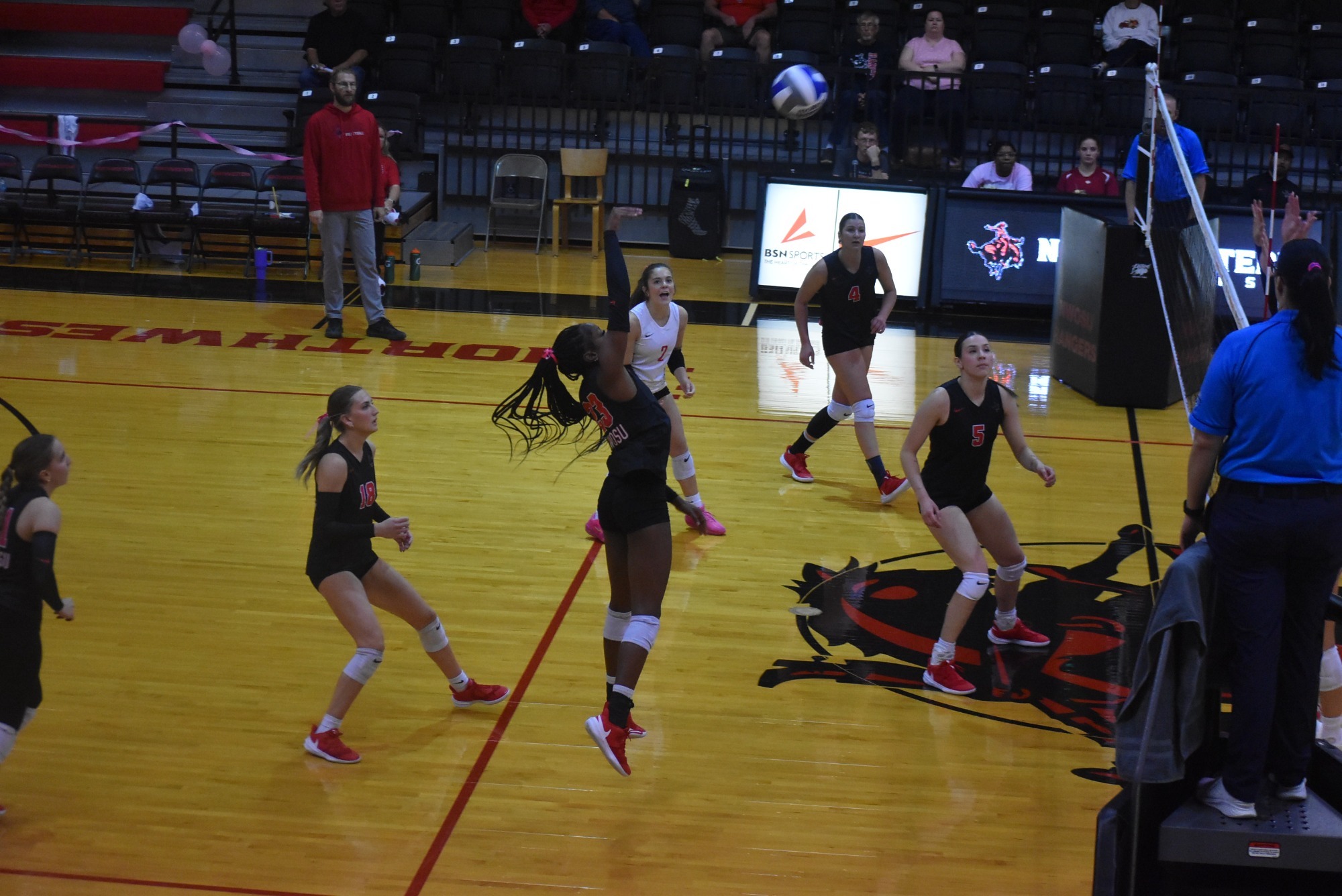 Volleyball player hitting a ball