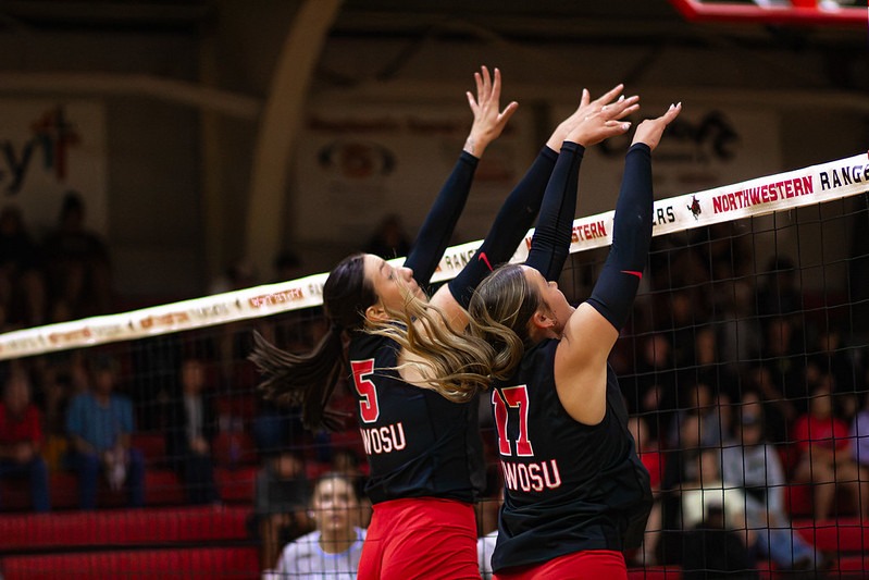 Ranger Volleyball players jumping to block the ball