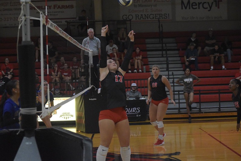 Northwestern Volleyball player hitting the ball