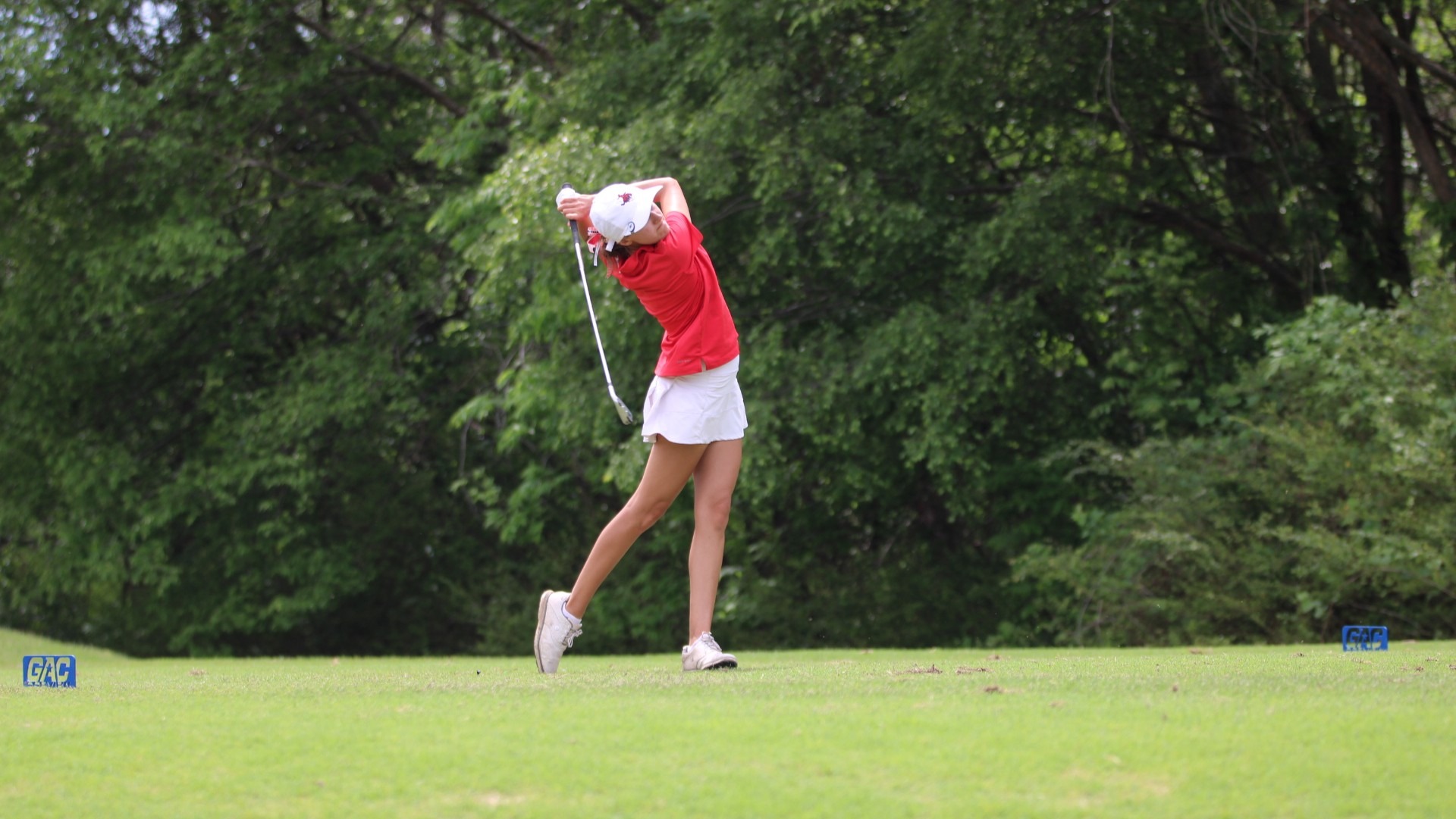 Northwestern golfer Gracie Doke hits a golf ball.