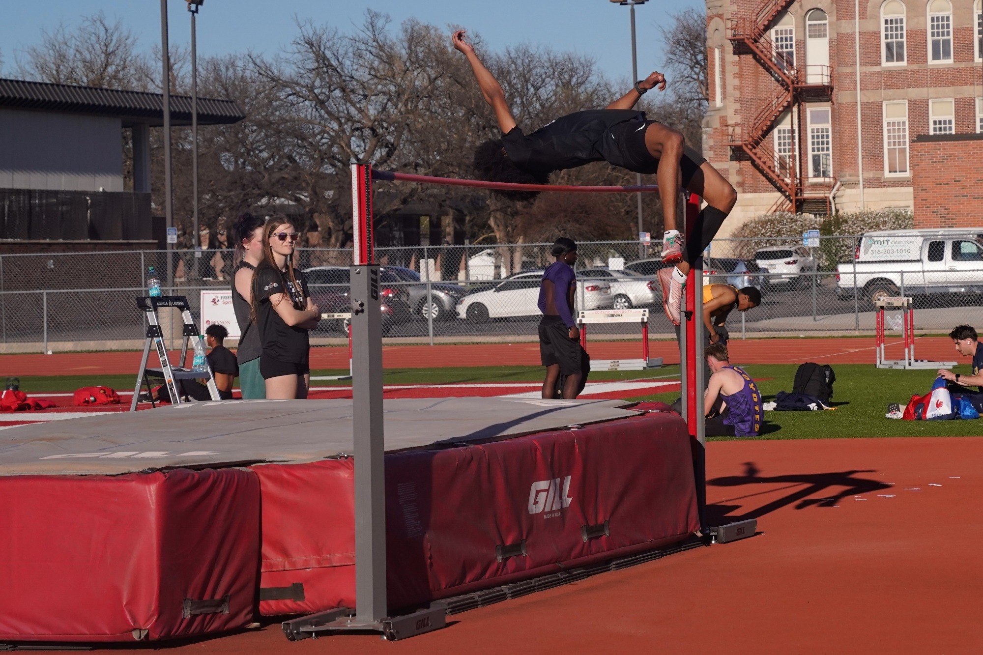 Track athlete jumping at a track meet
