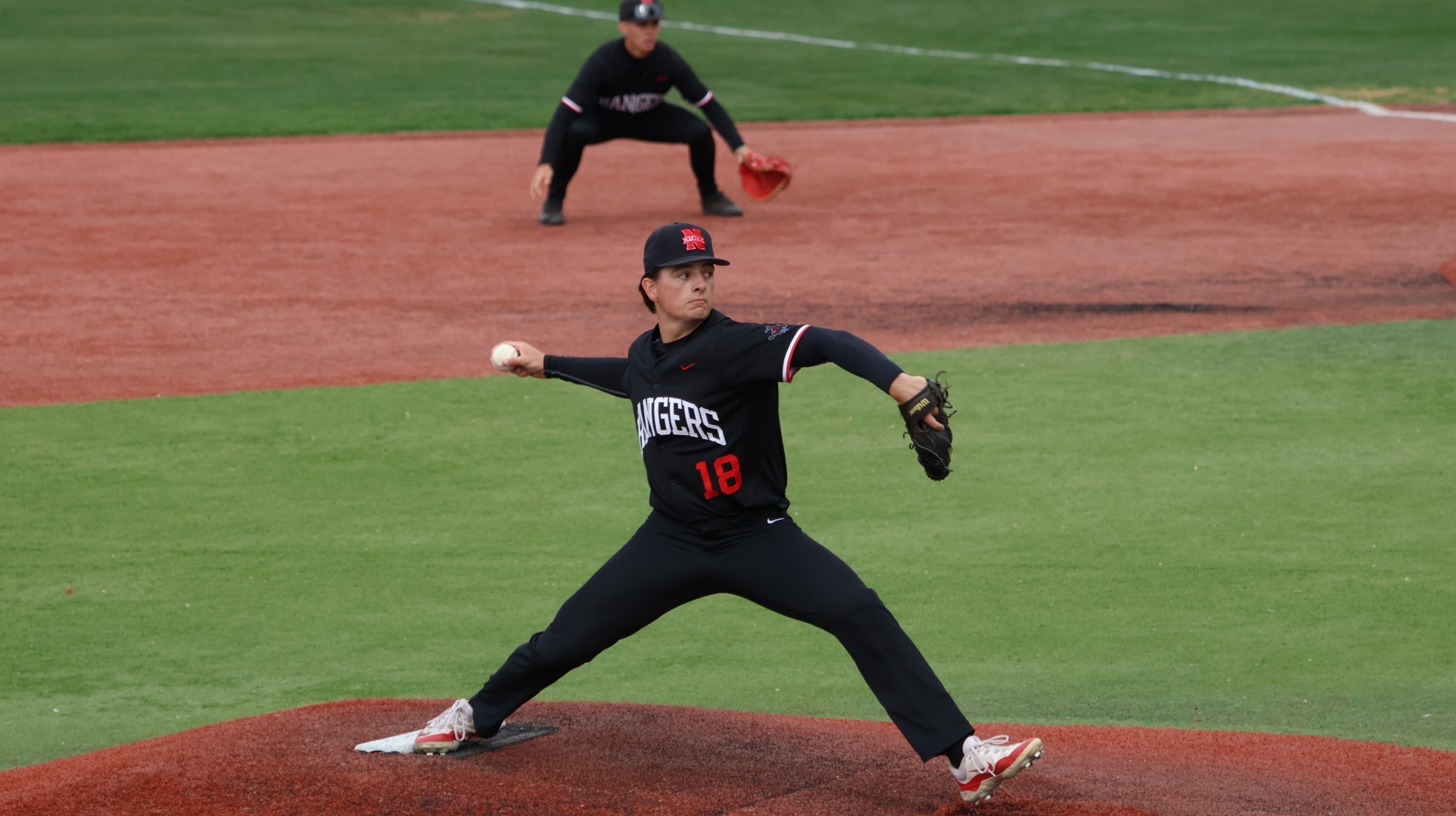 Northwestern pitcher Will Kates winds up while pitching.