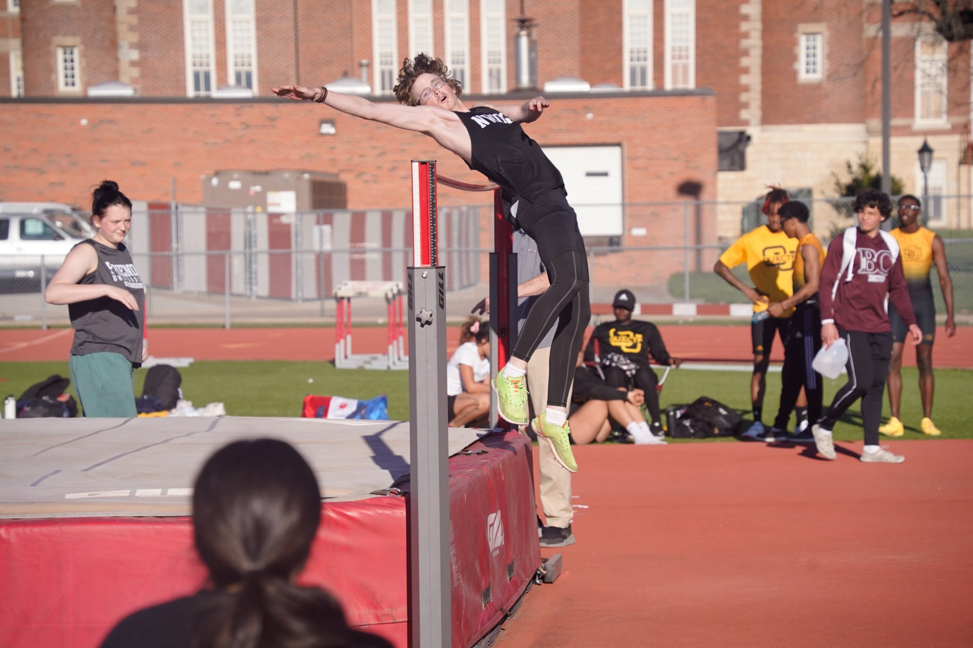 Track and Field athlete jumping at a meet