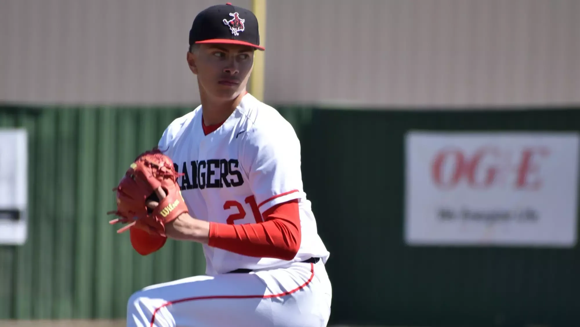 Logan Sandoval begins to wind up his pitch.