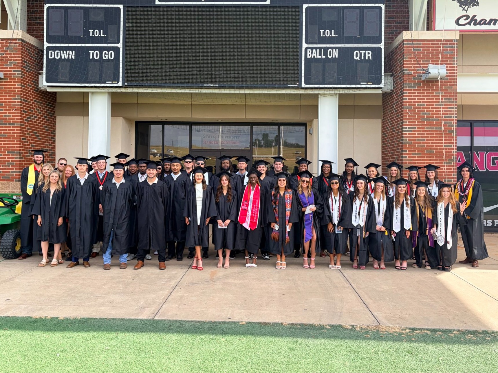 Student-Athletes posing for picture on graduation day