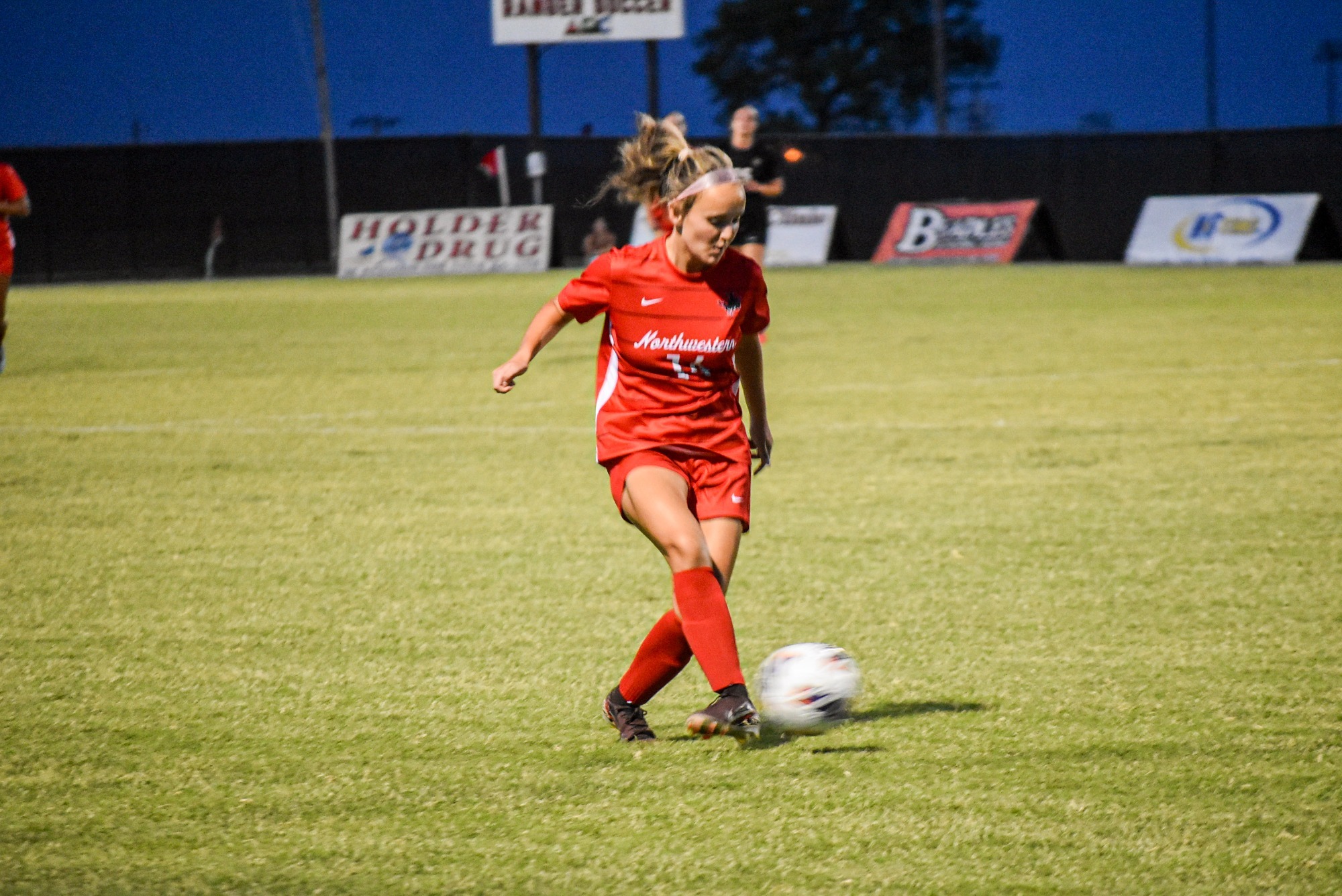 Northwestern Soccer Player kicking ball