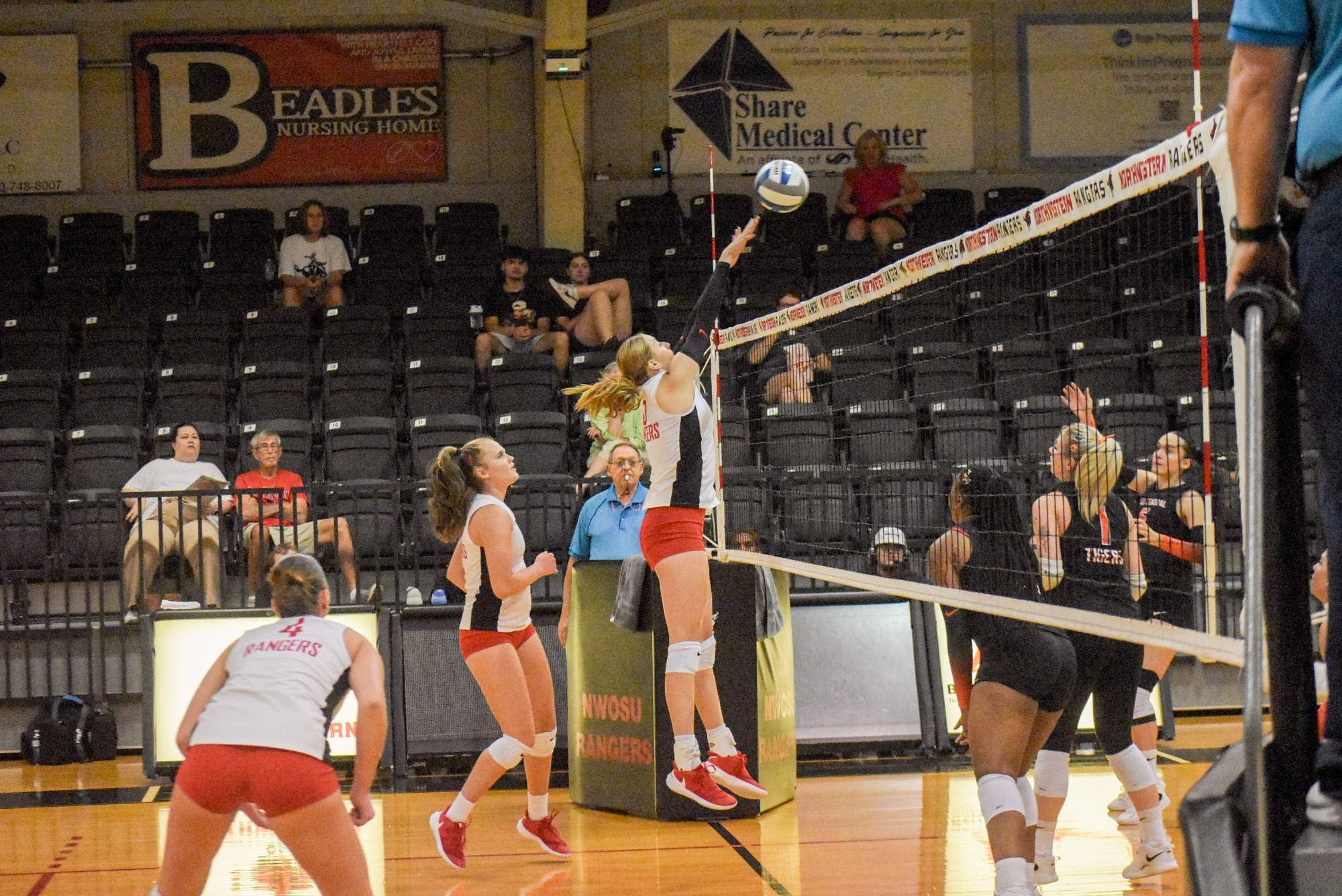 Northwestern volleyball player blocking a ball