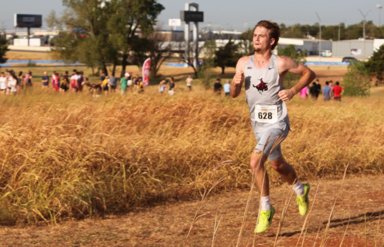 Riley Herndon runs during a cross country meet