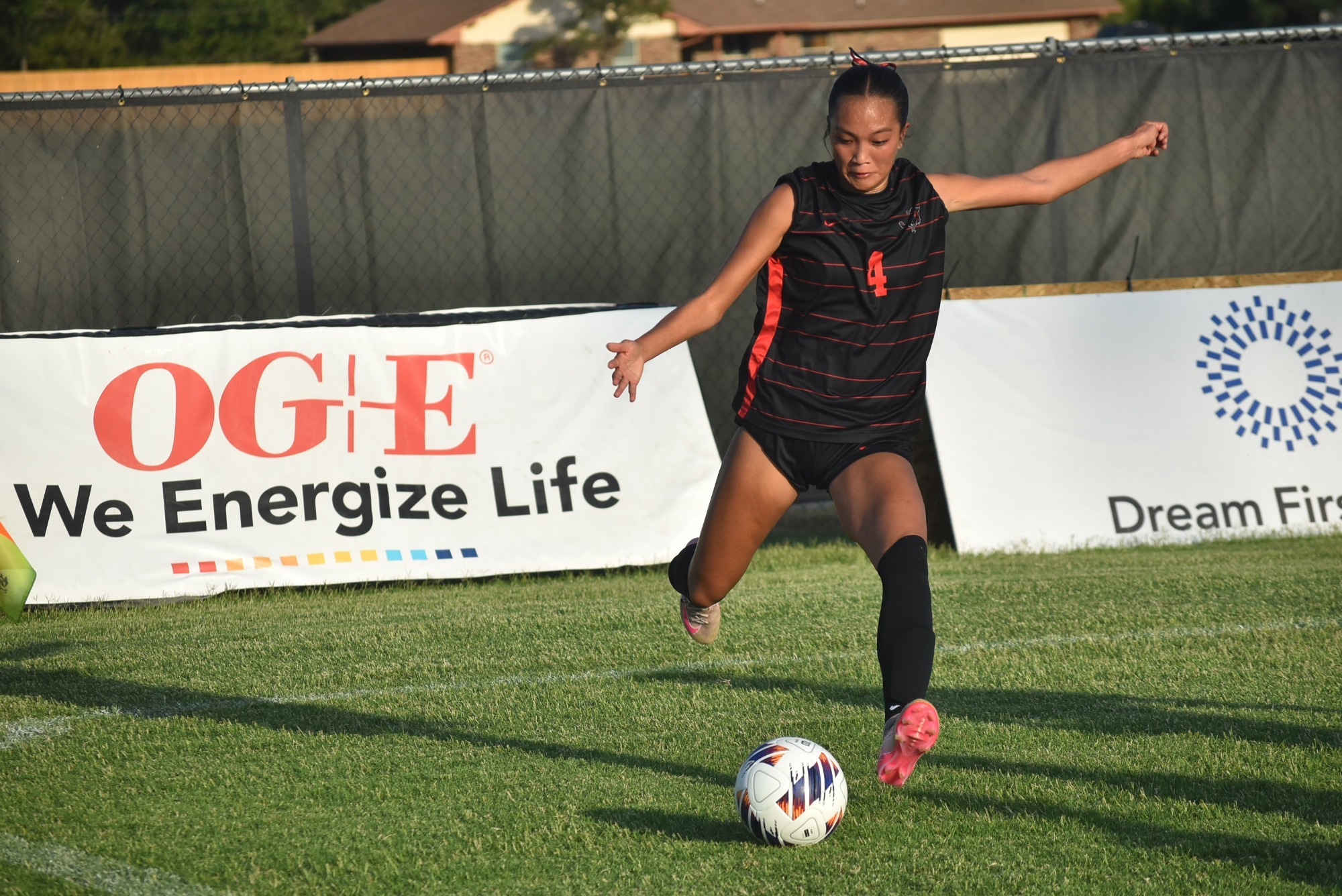 Elie Dang kicks the ball