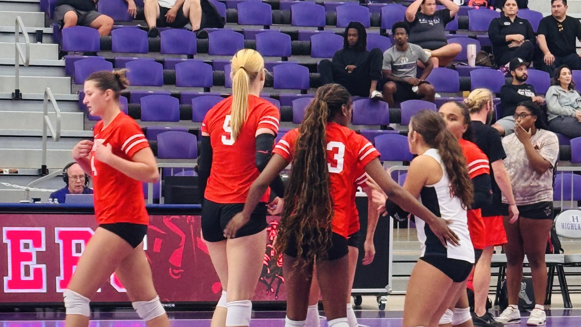 Volleyball Team huddling together