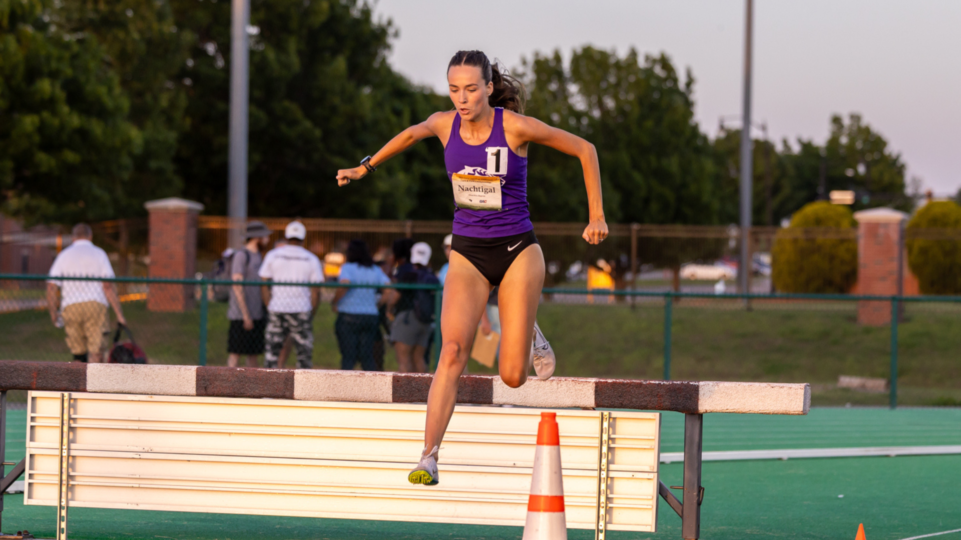 Katelynn Nachitgal hurdling in 3000m Steeplechase at 2025 GAC Championships