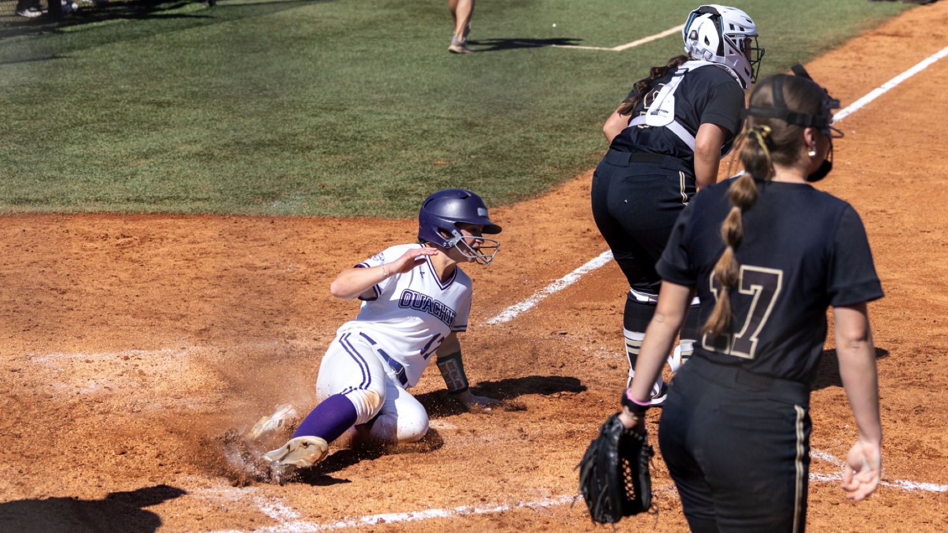 Reagan McCoy sliding home vs Harding