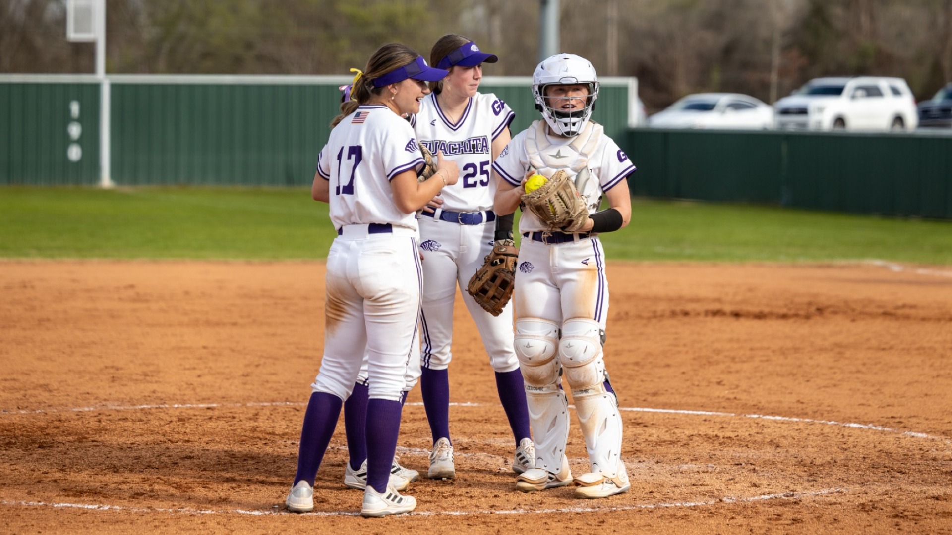 Softball mound visit vs Harding